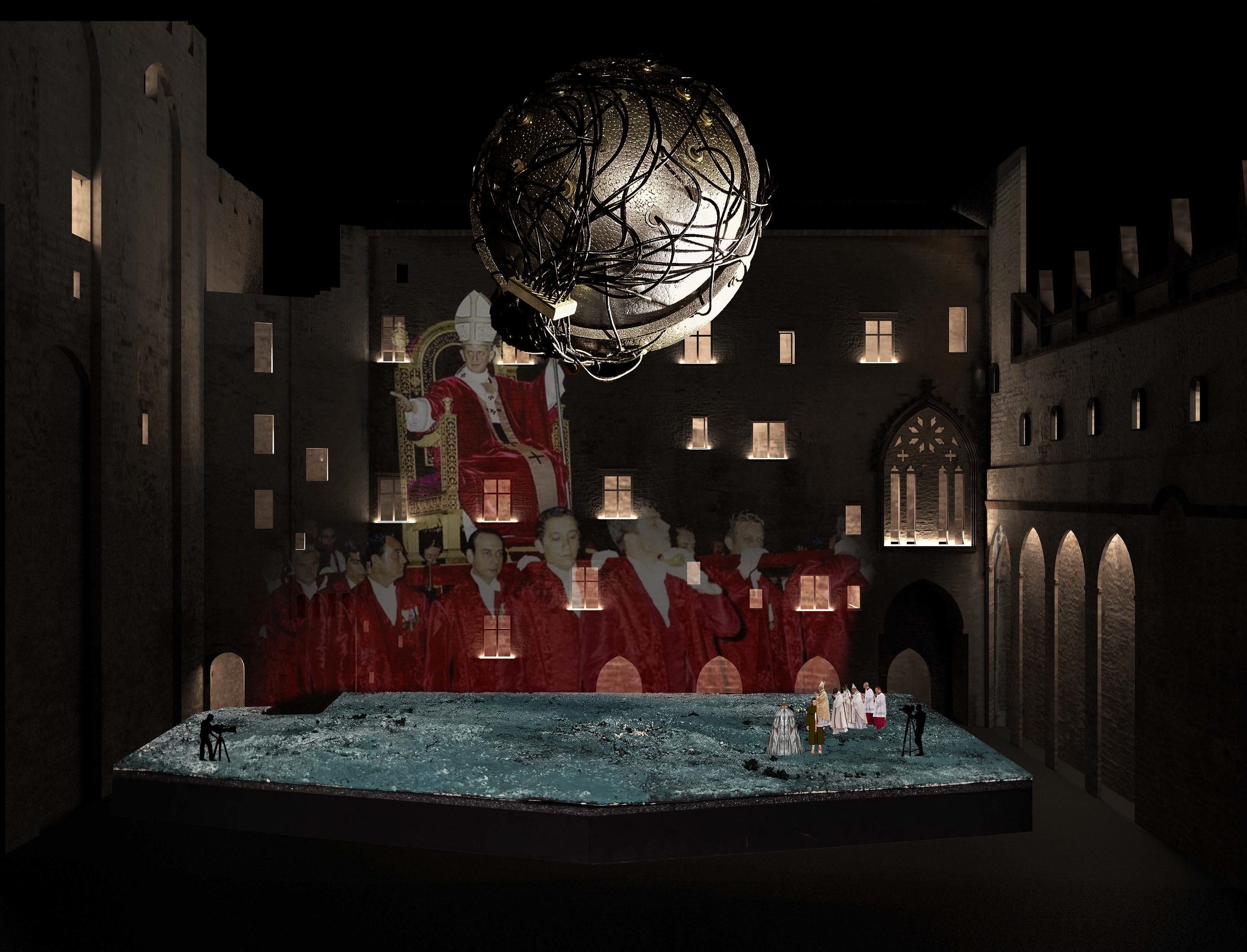 The image depicts a theatrical stage set at night within a courtyard of a historical building. A large, spherical metallic structure is suspended above. The backdrop features projections of religious figures. There are people on stage in front of the
