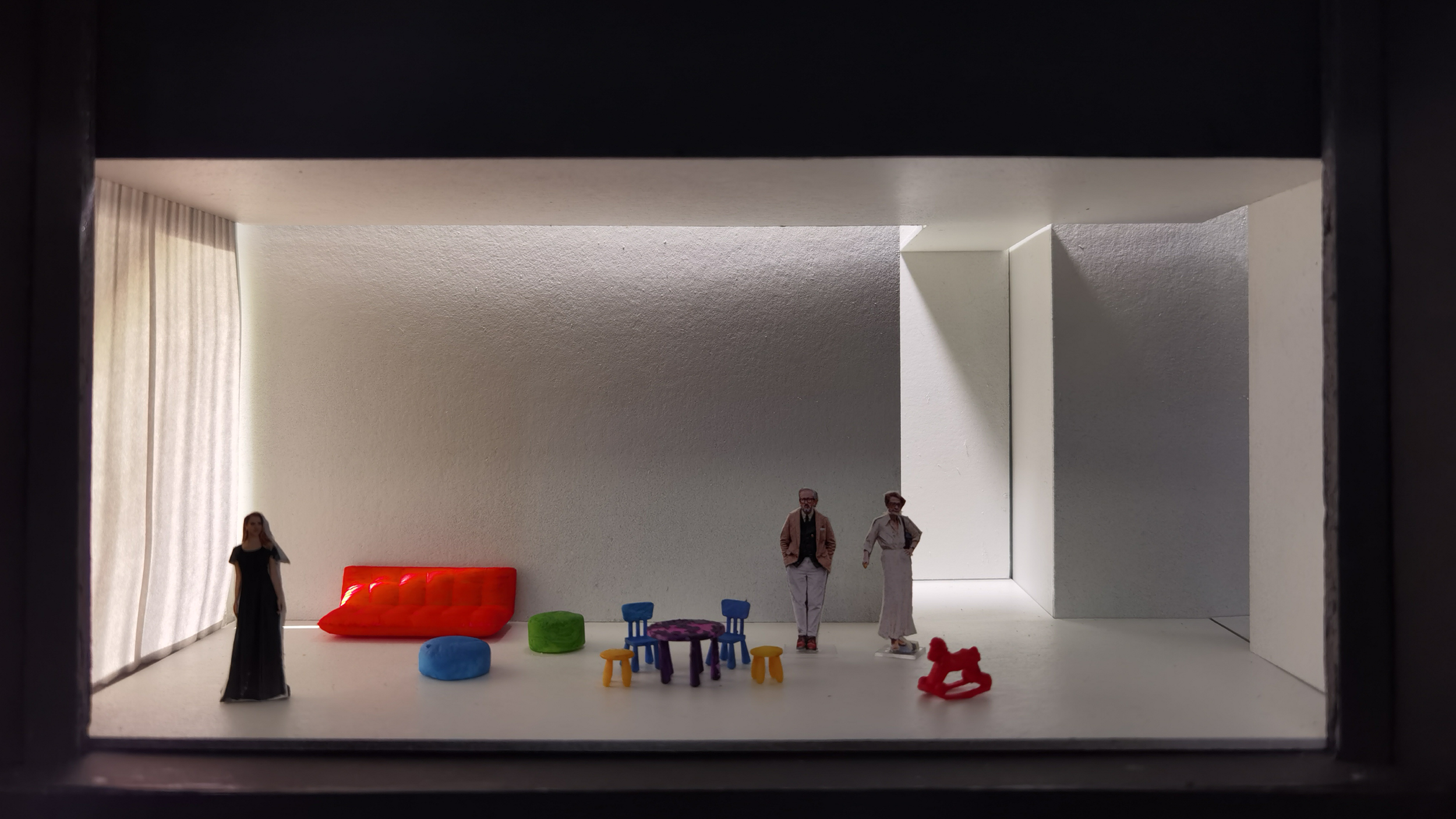 Miniature room diorama with colorful furniture and figurines