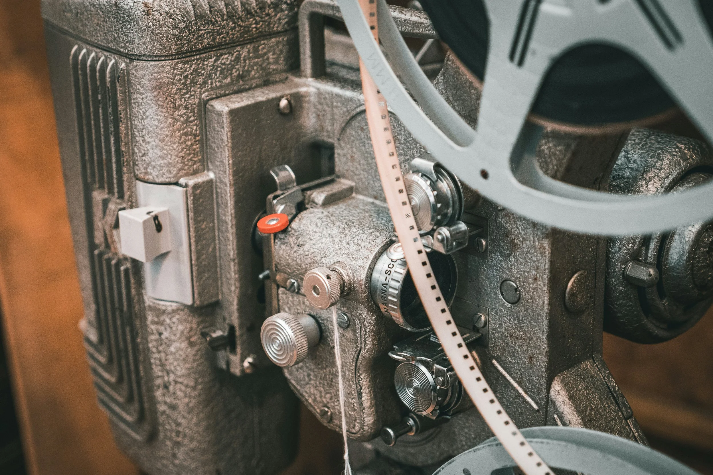 close up of old film projector with orange filter