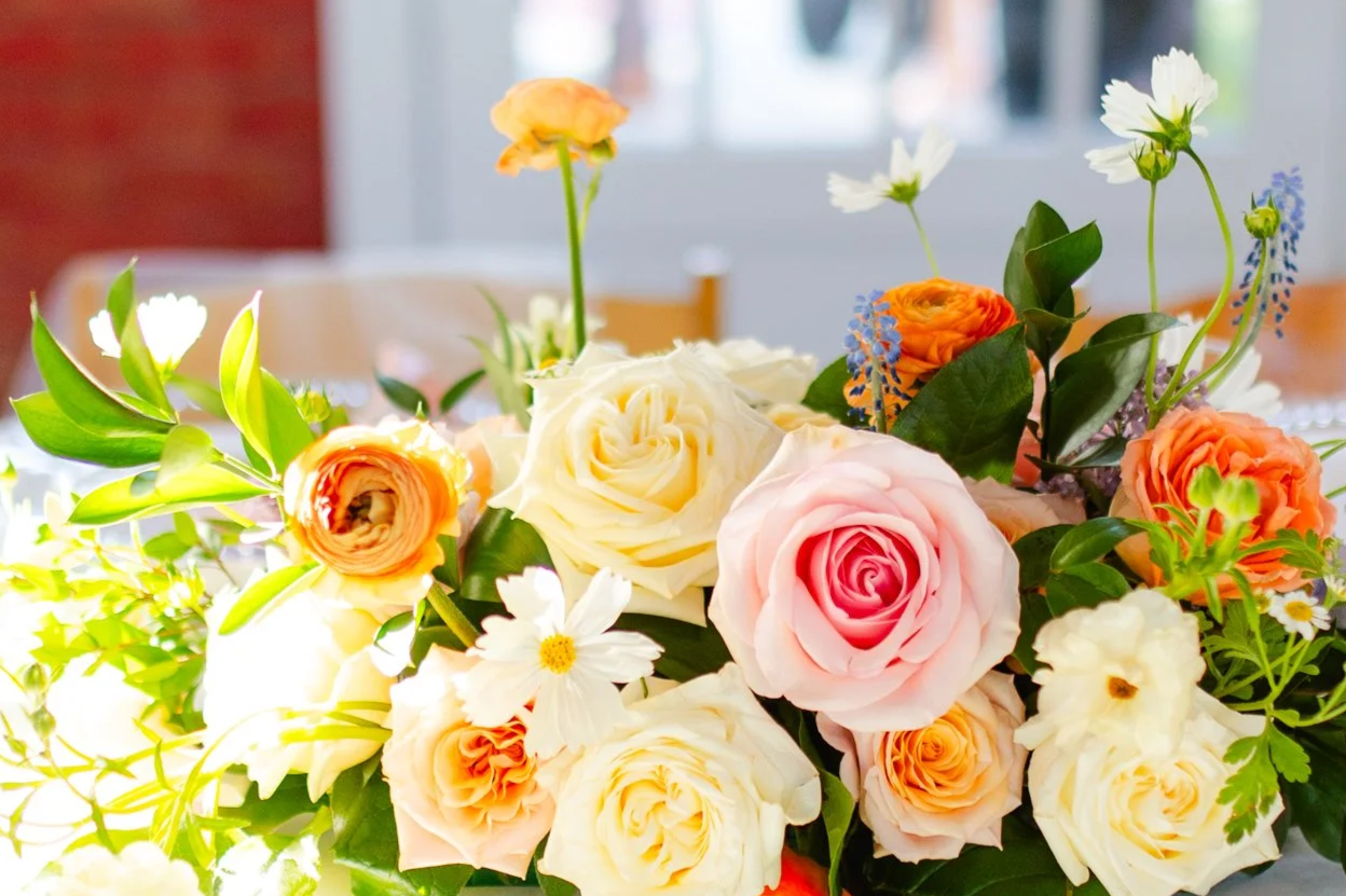 Roses, ranunculus, daisies, plants and foliage designed perfectly to create a beautiful flower arrangement for a one of a kind wedding. 