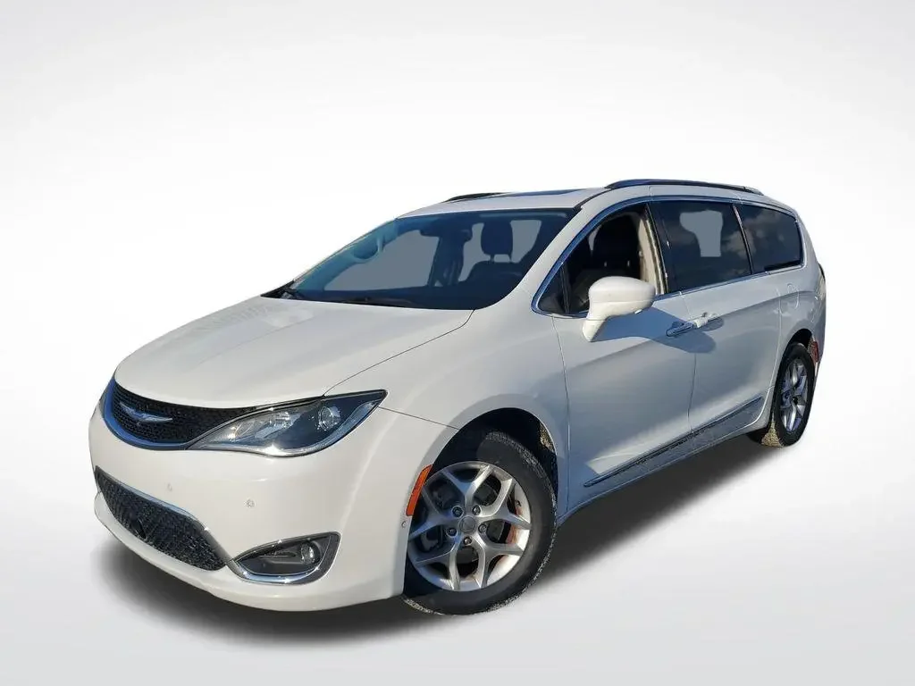 A white Chrysler minivan on a plain white background.