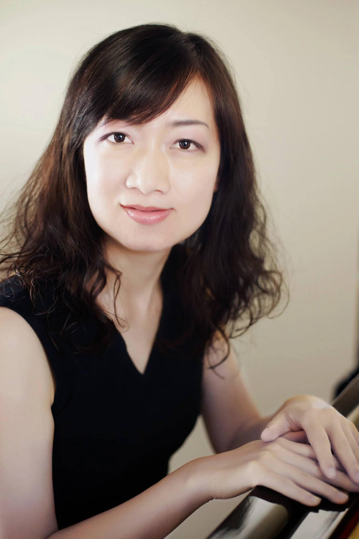 female seated soft portrait neutral background