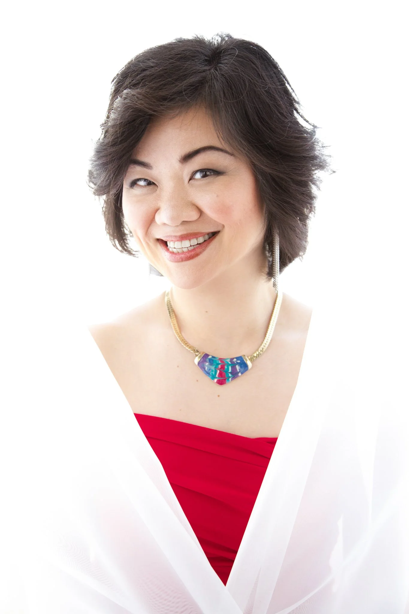 female asian red dress high key background