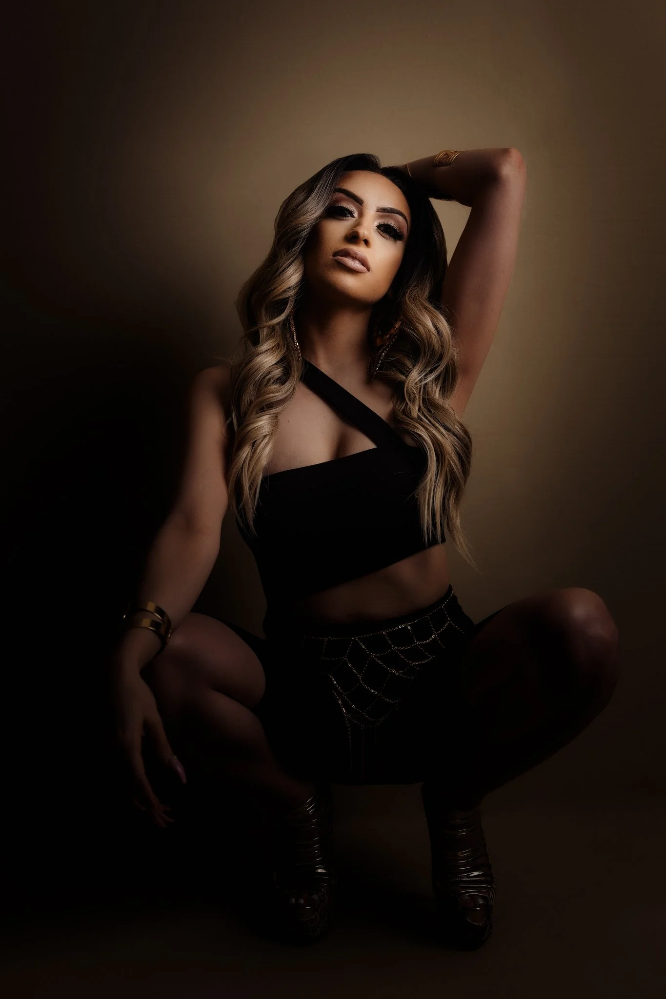 Soft natural fine art portrait seated woman beige background