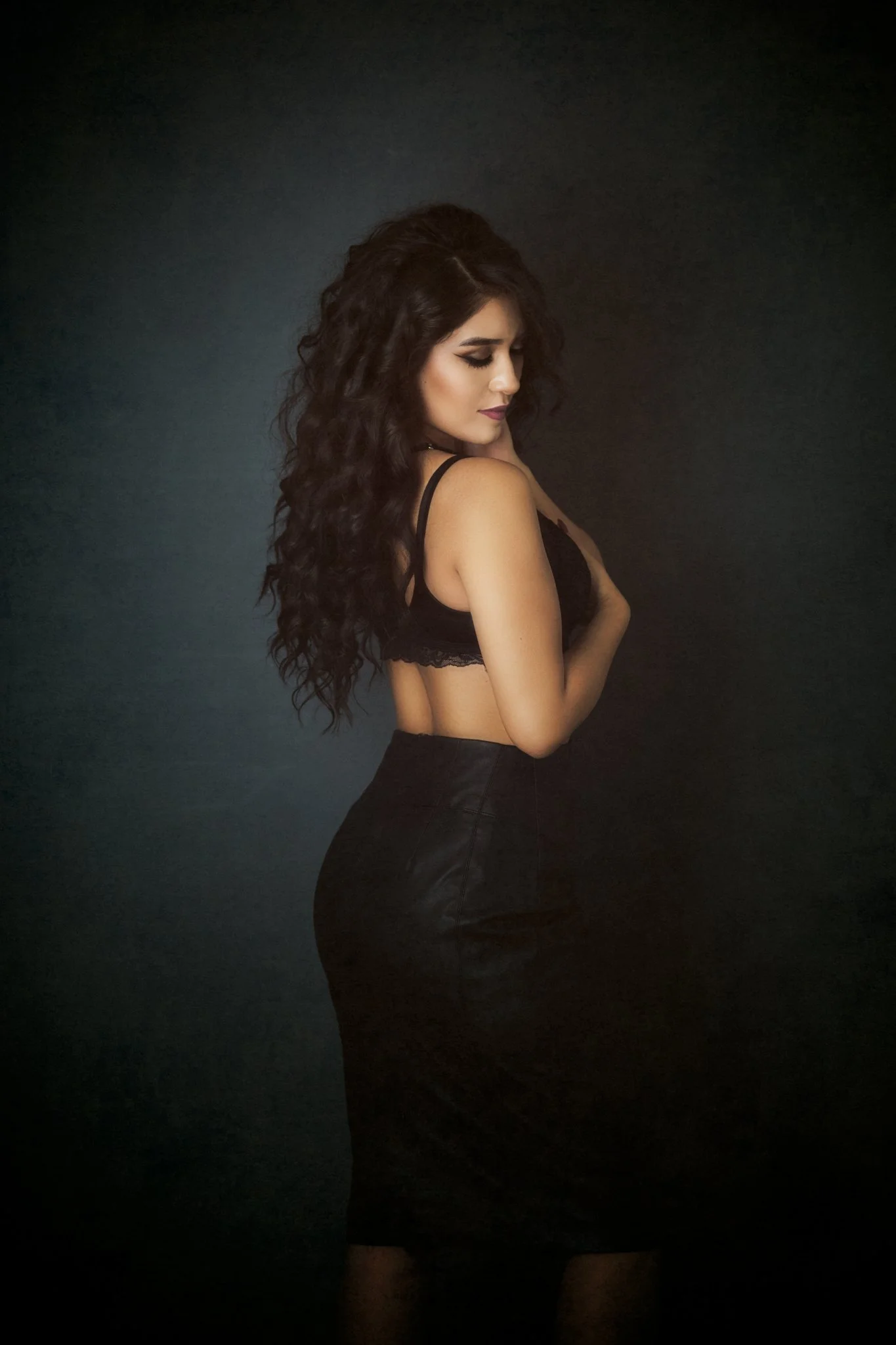 Elegant backlit fine art portrait woman black dress