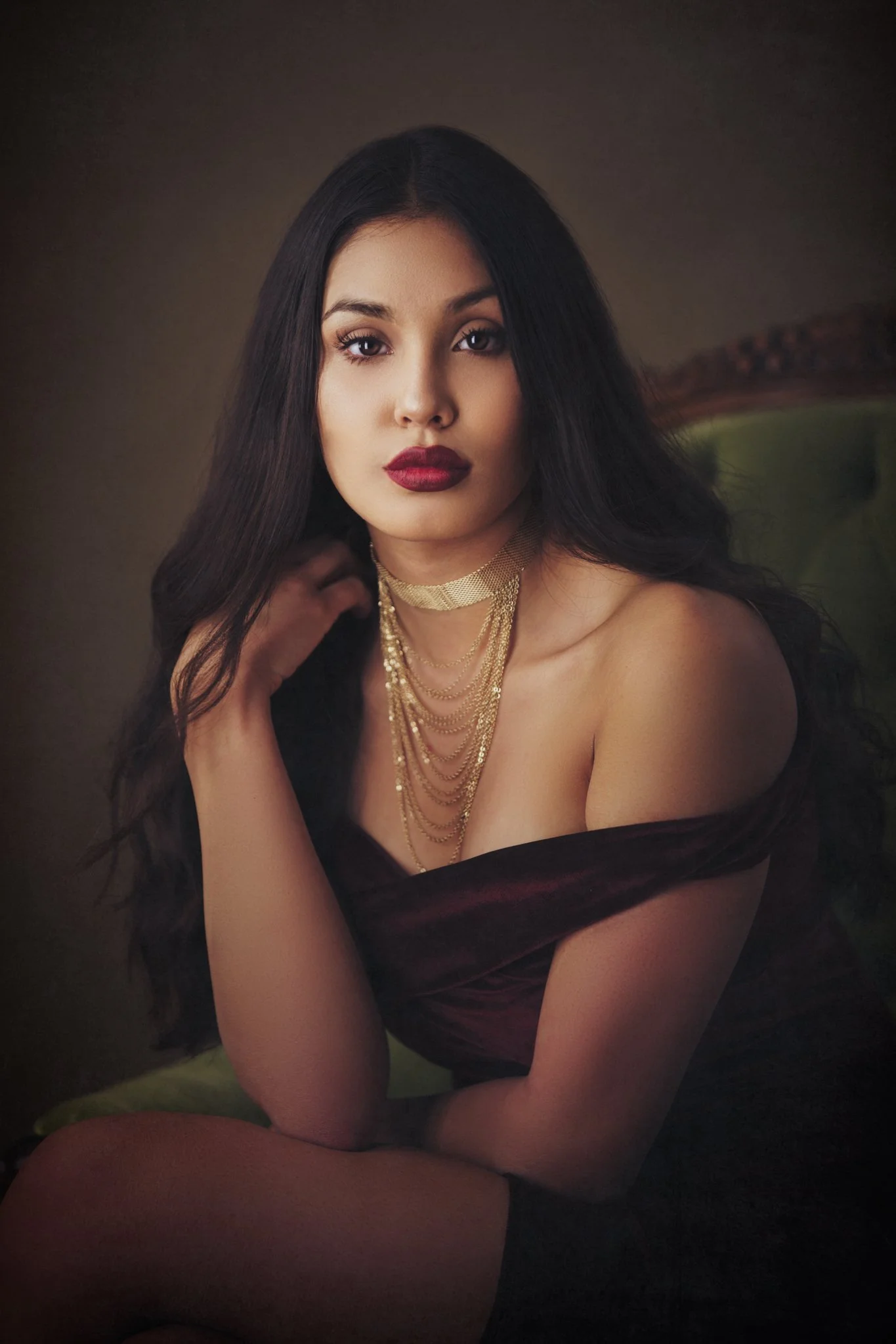 Elegant fine art portrait with gold jewelry and soft painterly lighting