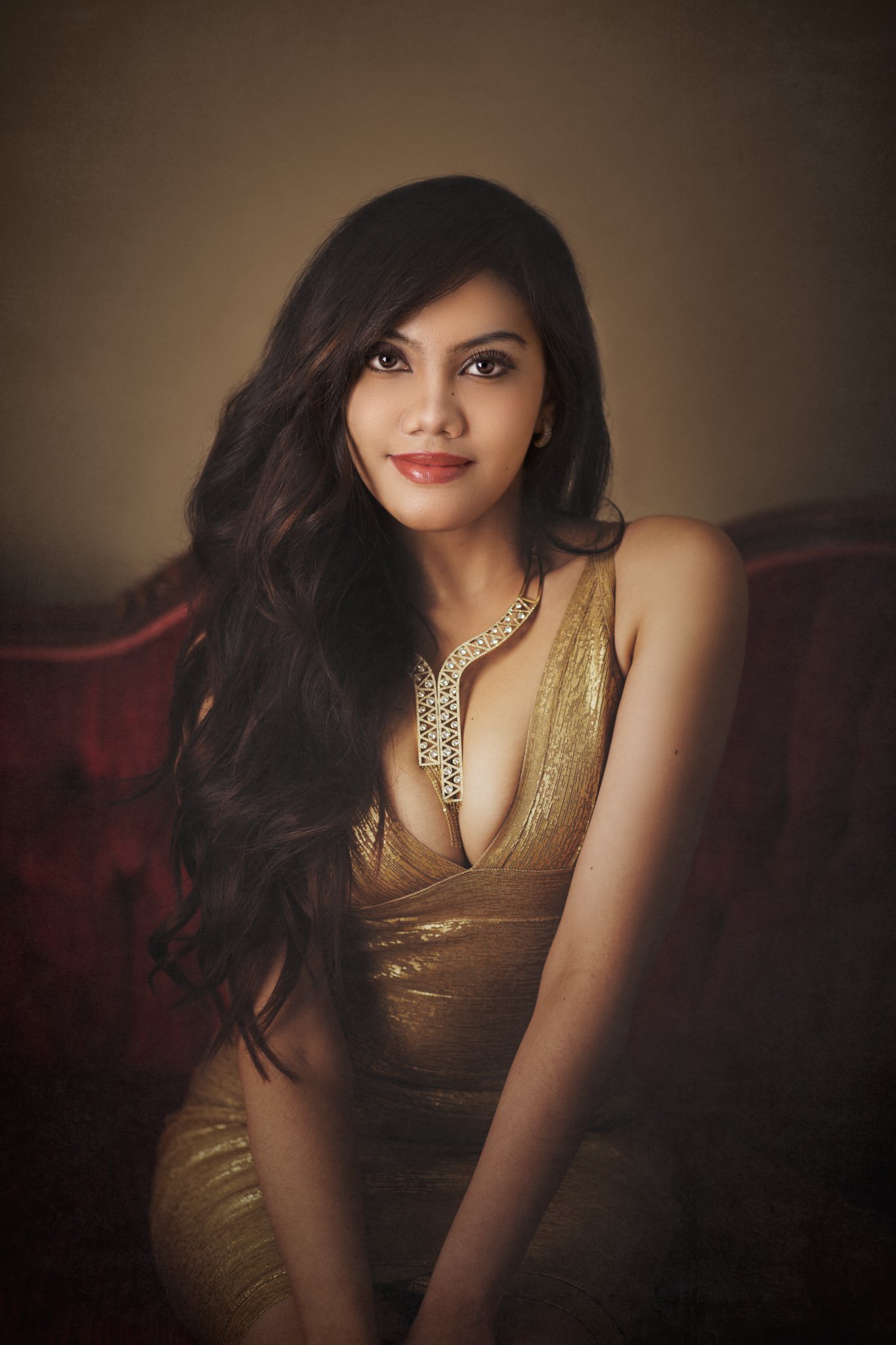 Glamorous fine art portrait woman gold dress studio