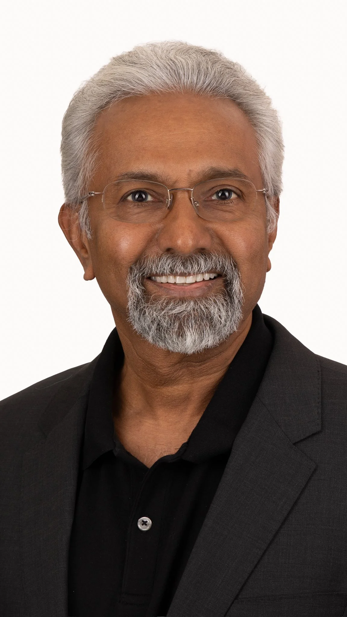 male standing headshot portrait white background