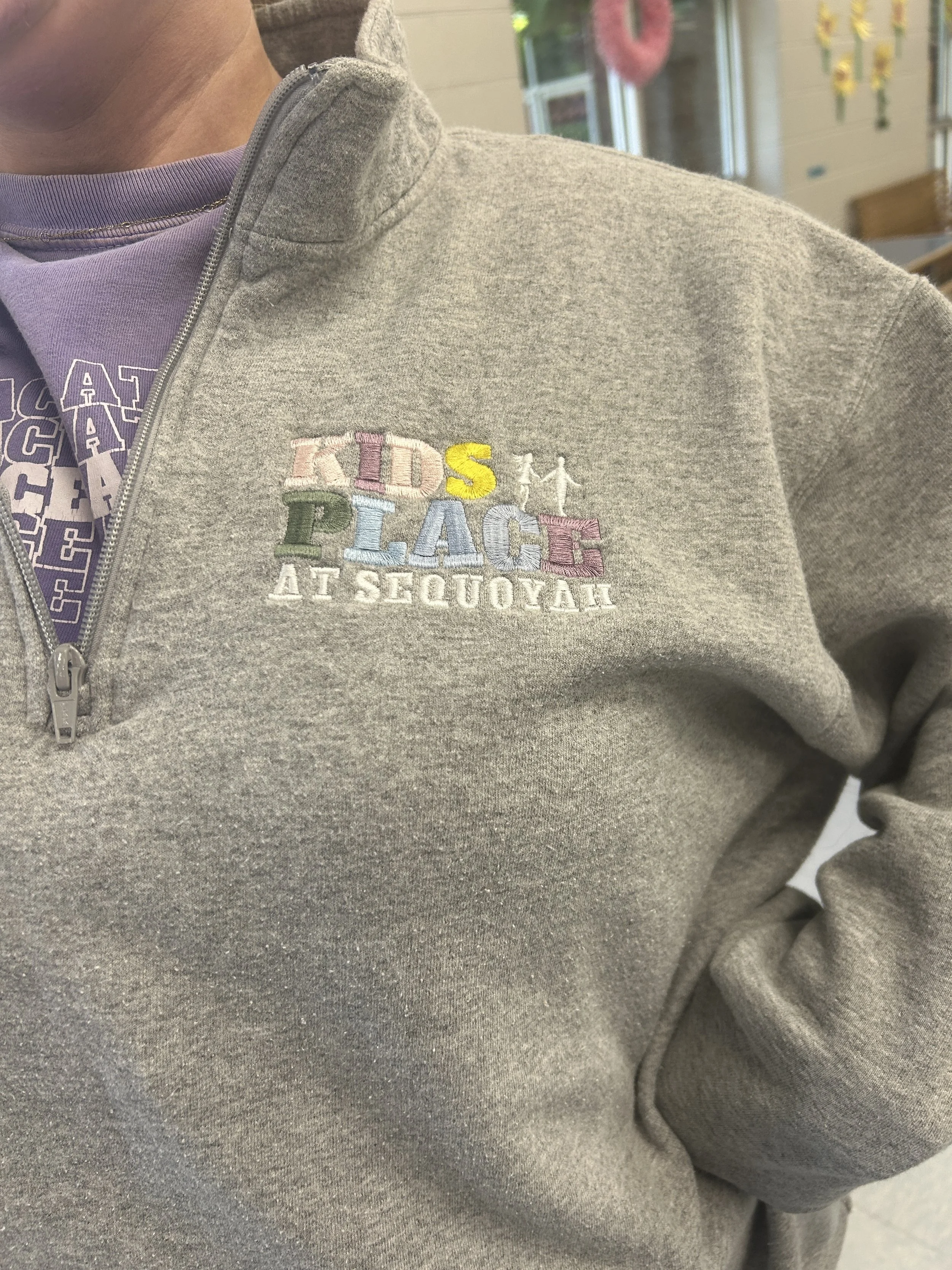 The logo on a quarter zip