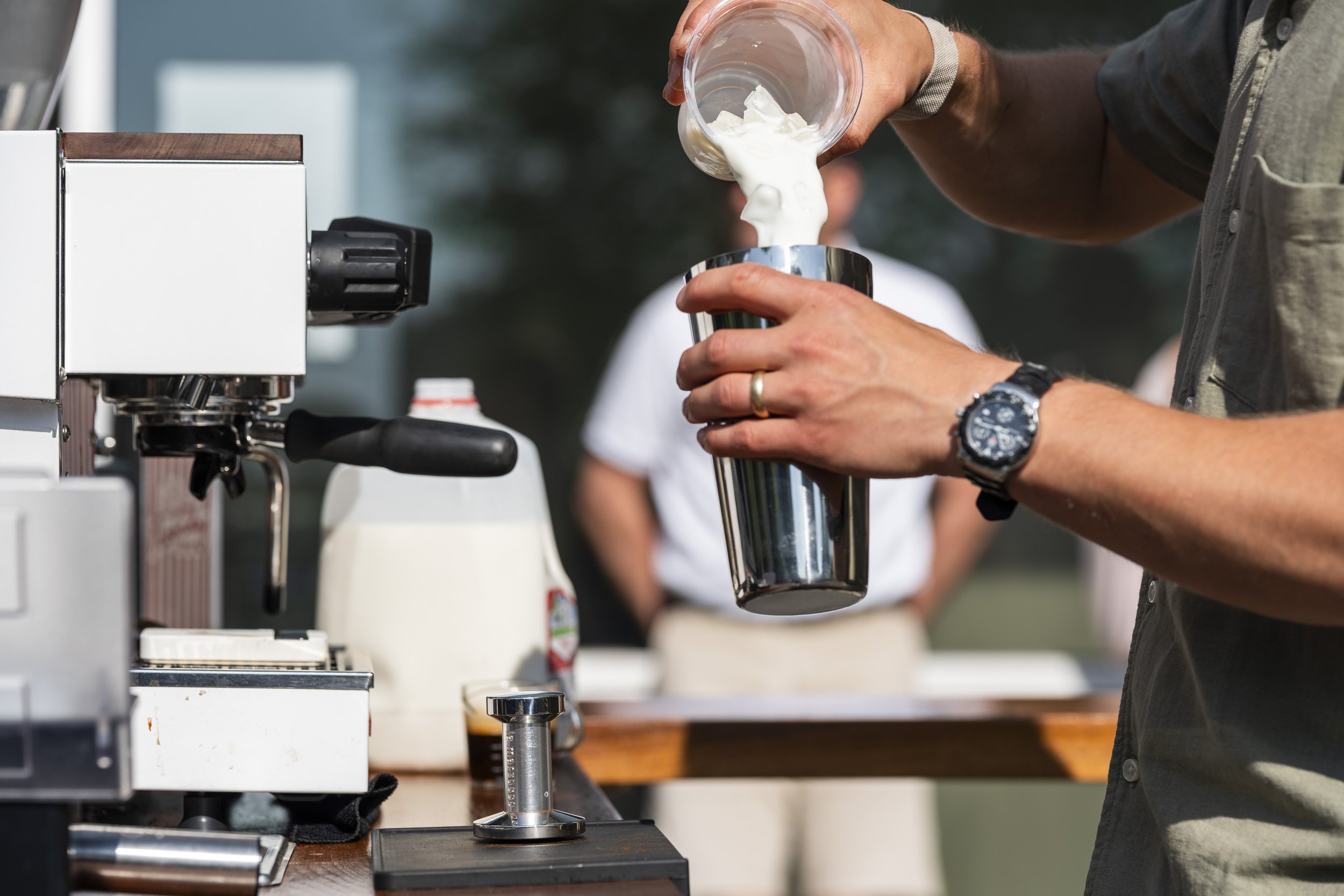 barista making iced latte espresso drink