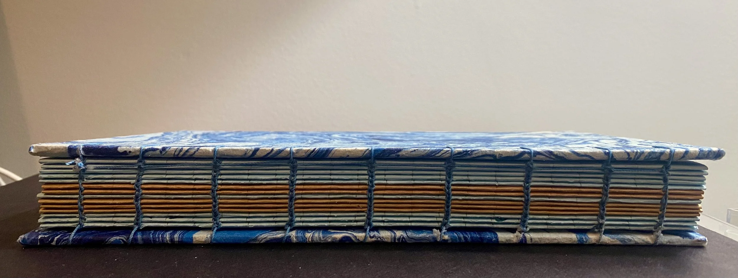 Hand-bound artist book Decorative marbled paper (India), Coptic Stitch, linen thread   
8.75 × 5.75 in     2024