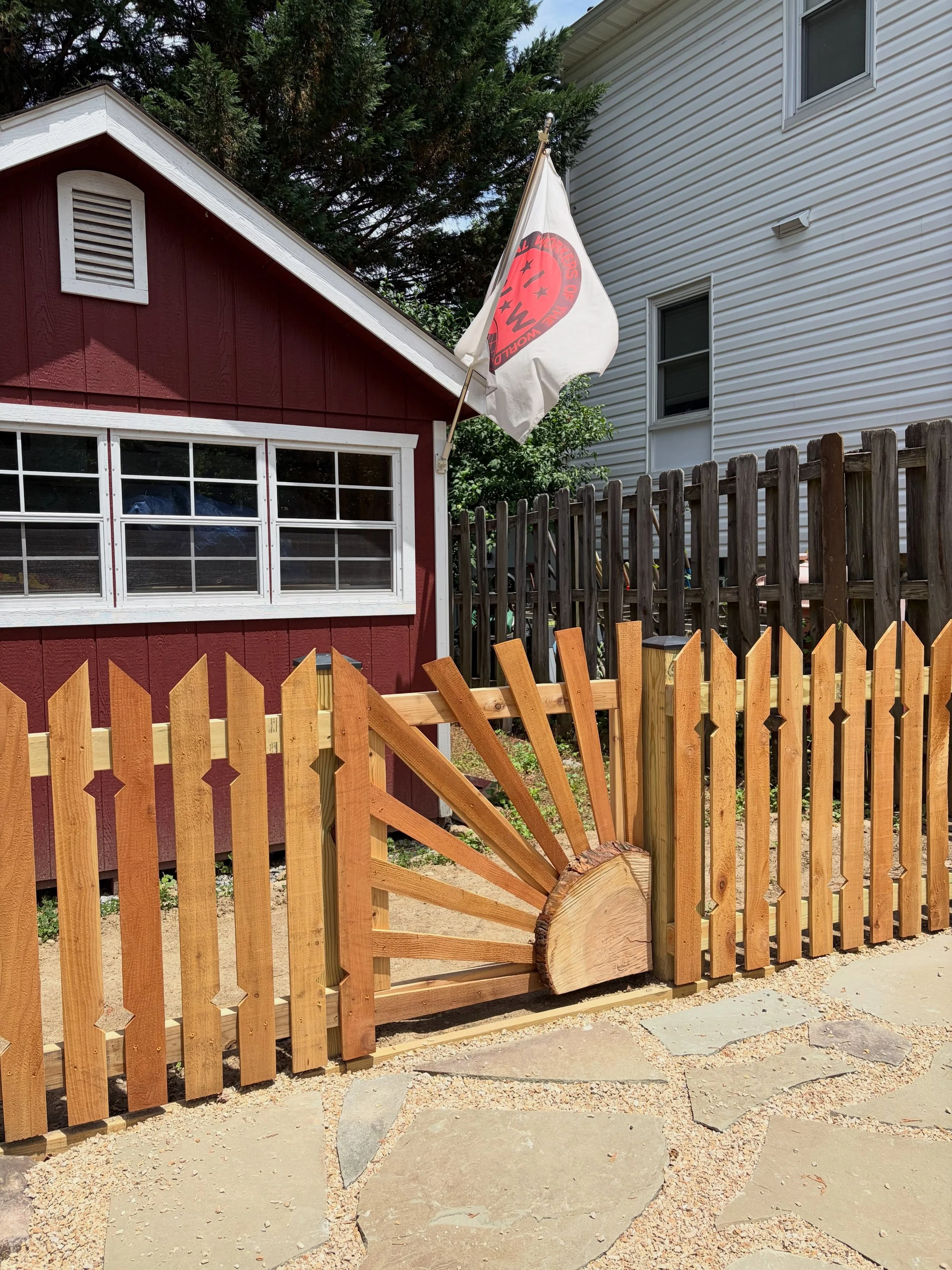 a wee fence with a side of stone. swipe for the before! the client had a great vision for this driveway and we were happy to execute it with little touches of our own. 🐱🚩