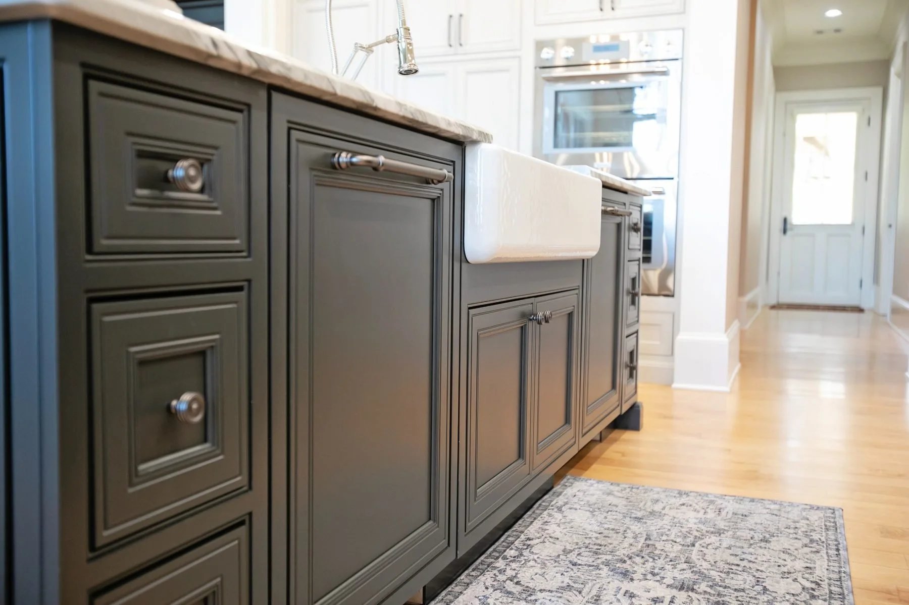 hixons-bluff-dark-kitchen-island-cabinetry.jpg