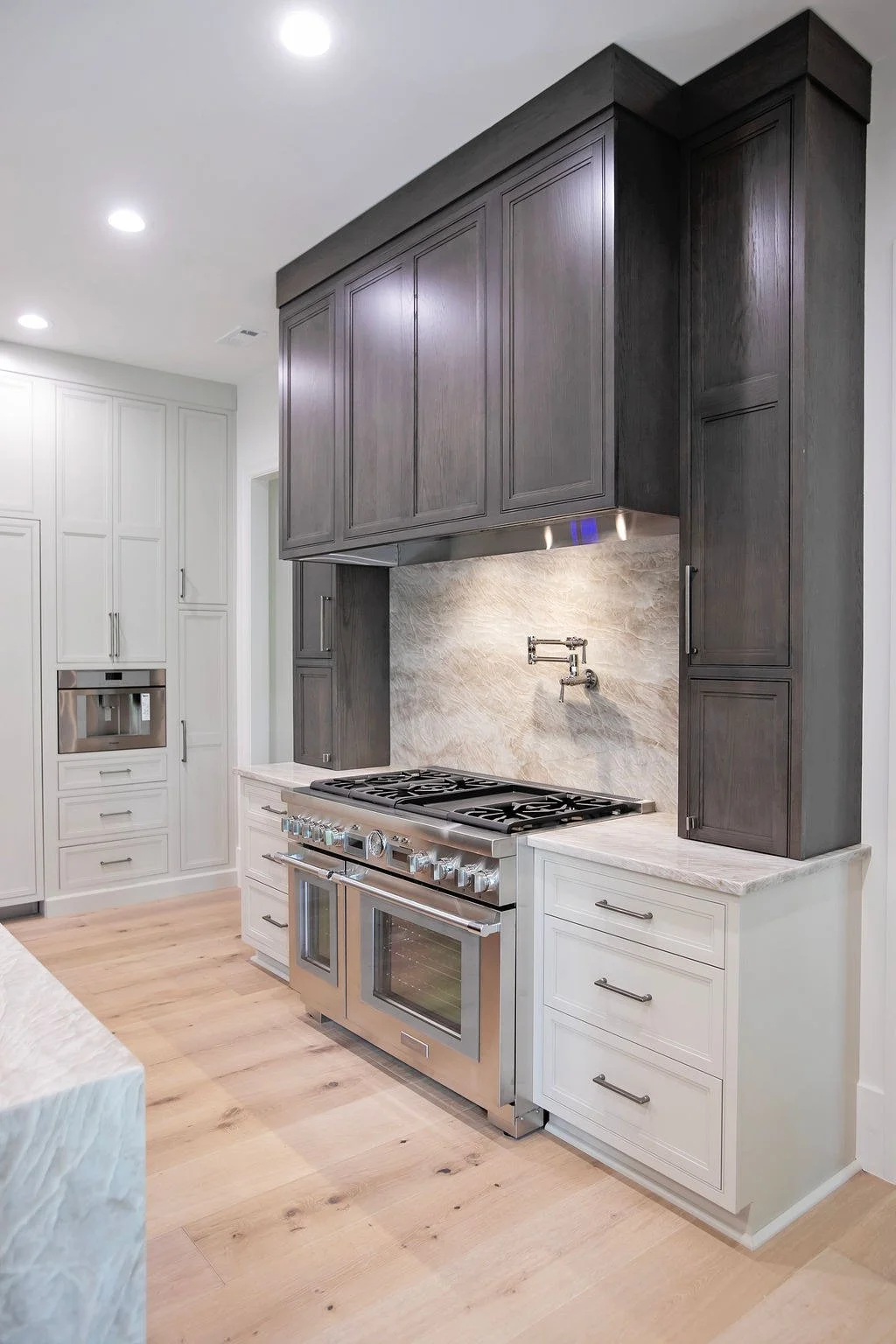 lake-oconee-kitchen-dark-wood-range-hood.jpg