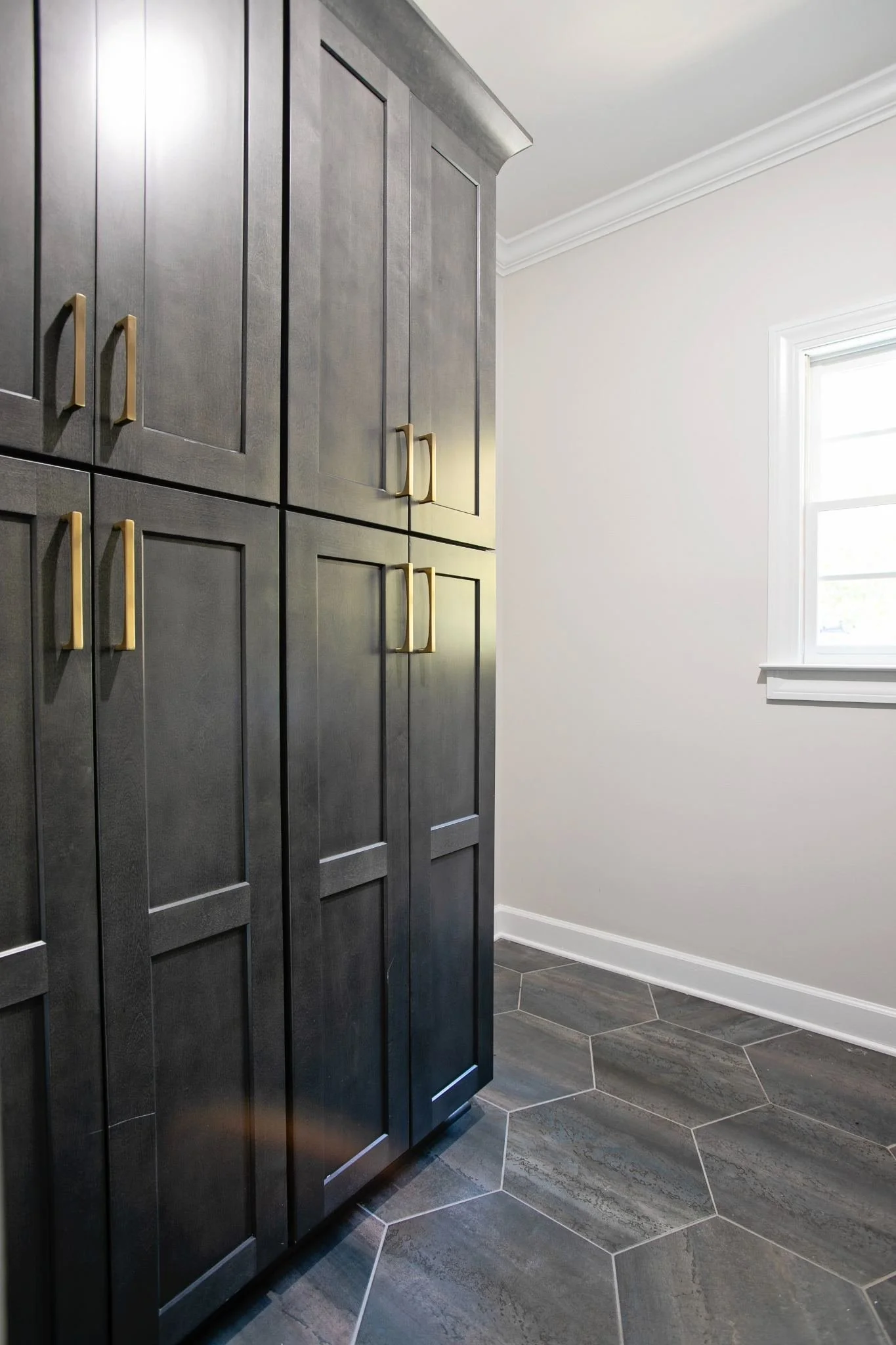 laundry-room-sink-dark-cabinets-brass-faucet.jpg