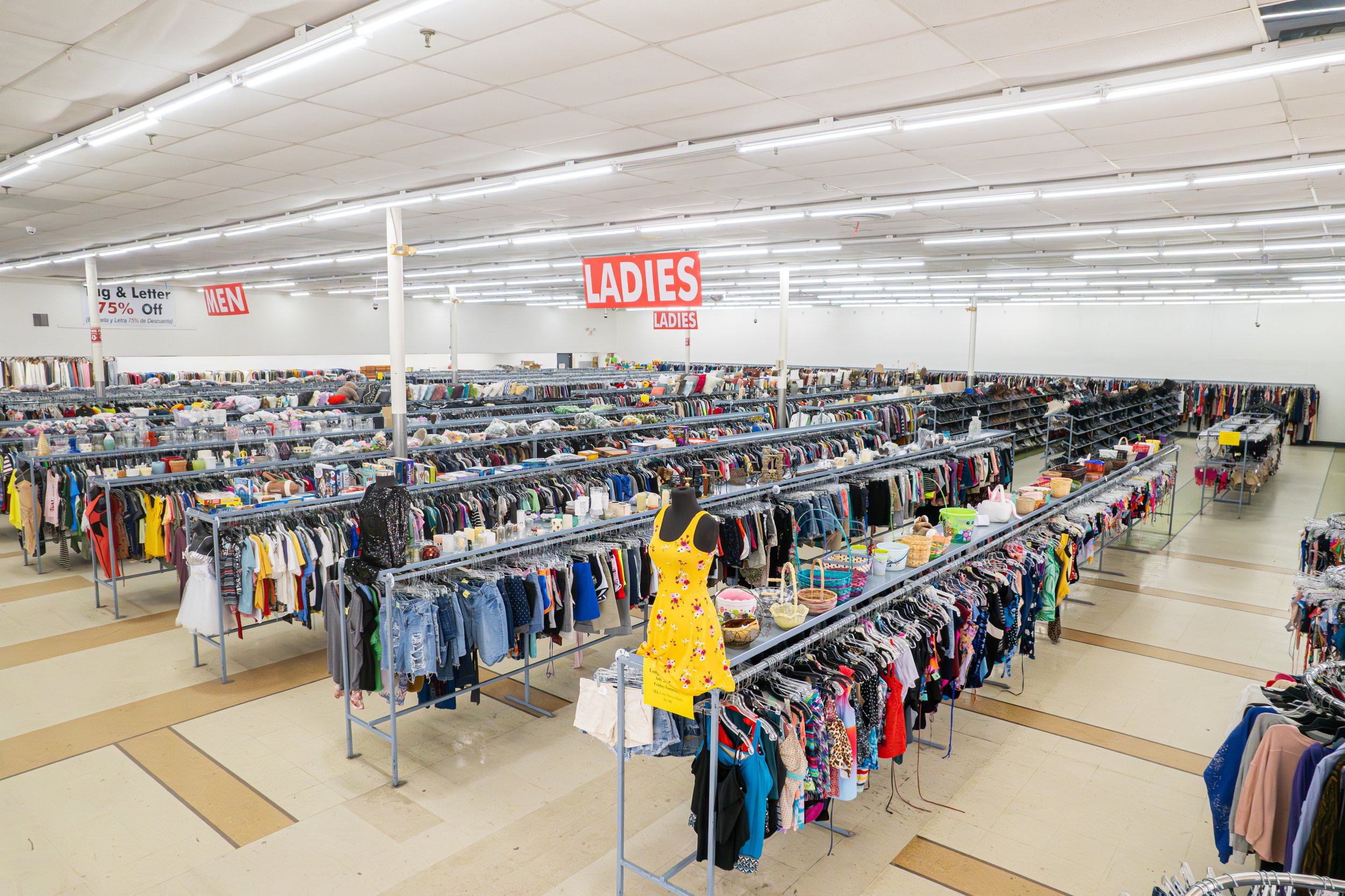 Thrift store interior with clothing racks