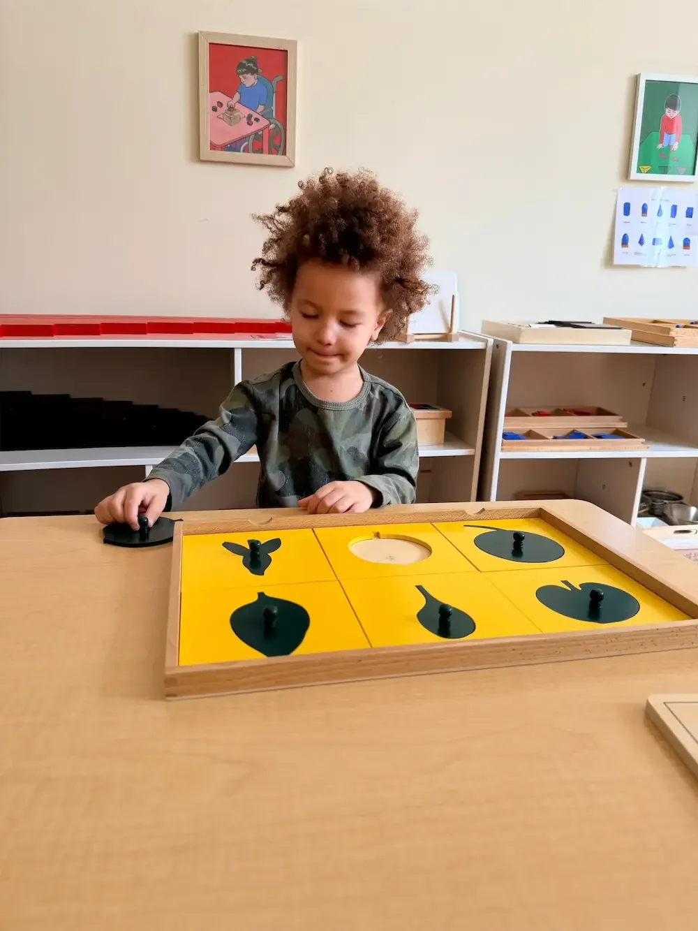 Child in Casa Classroom doing a Montessori work