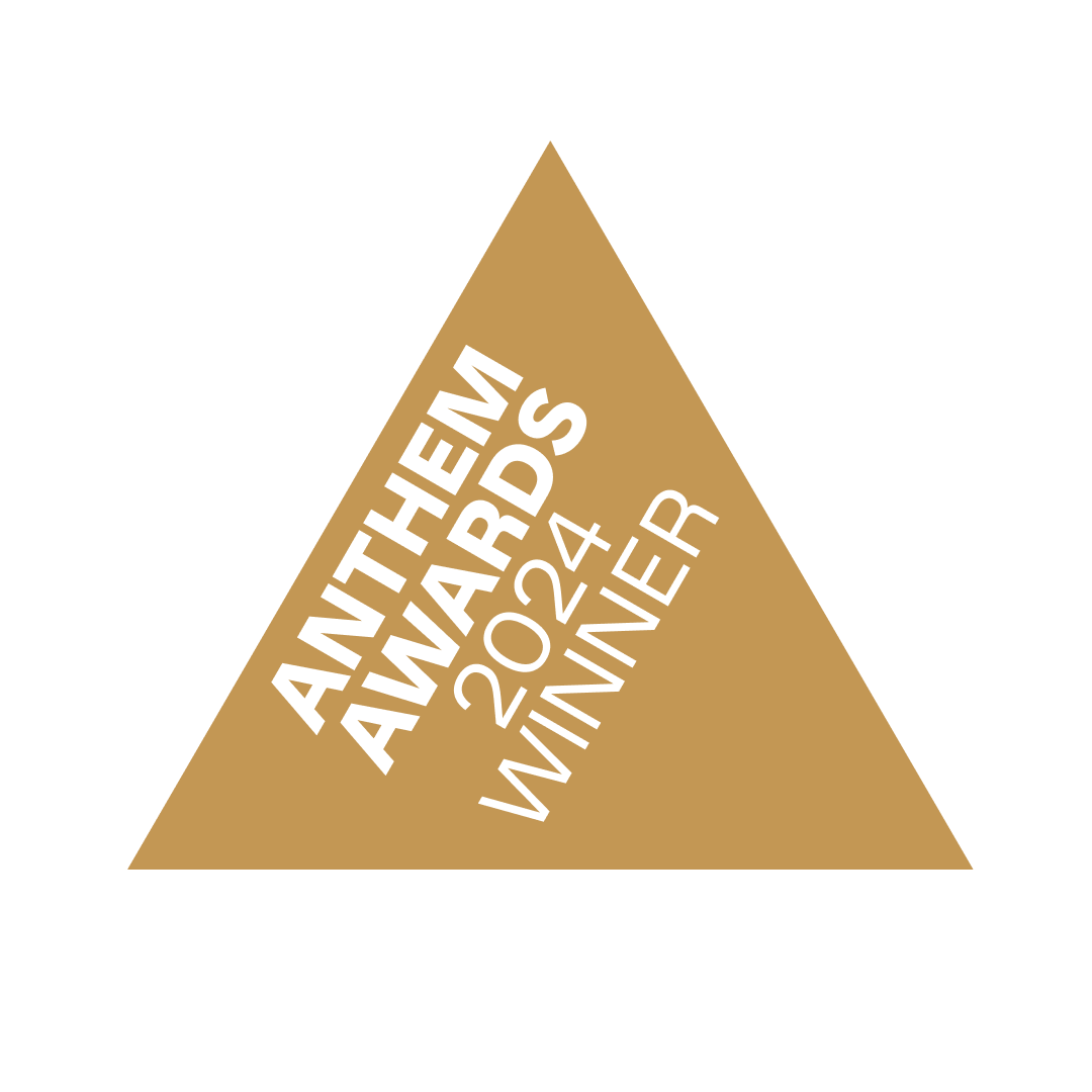 Triangular medal with gold color and white text that reads "Awards 2024 Winner, Anthony Awards."