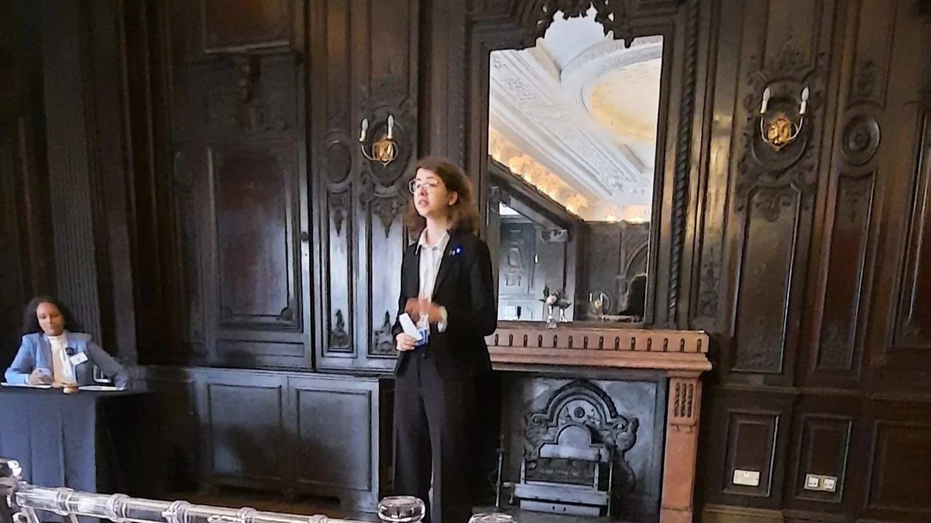 Kalina Pavlović, ESU Serbia 2024 National Public Speaking Competition winner, speaking at event in ornate hall.