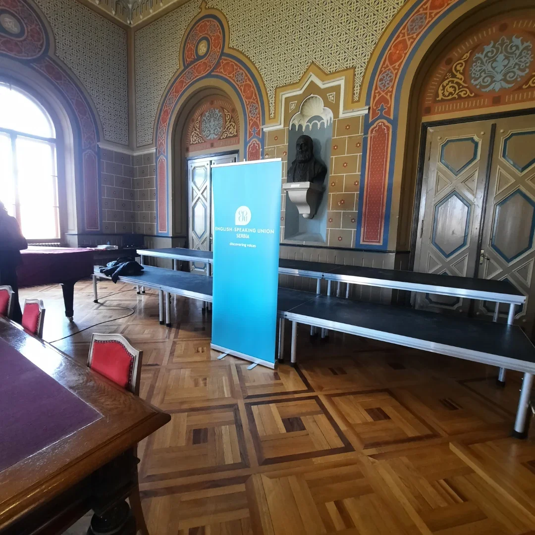 Ornate hall with ESU Serbia banner used for formal events and meetings.