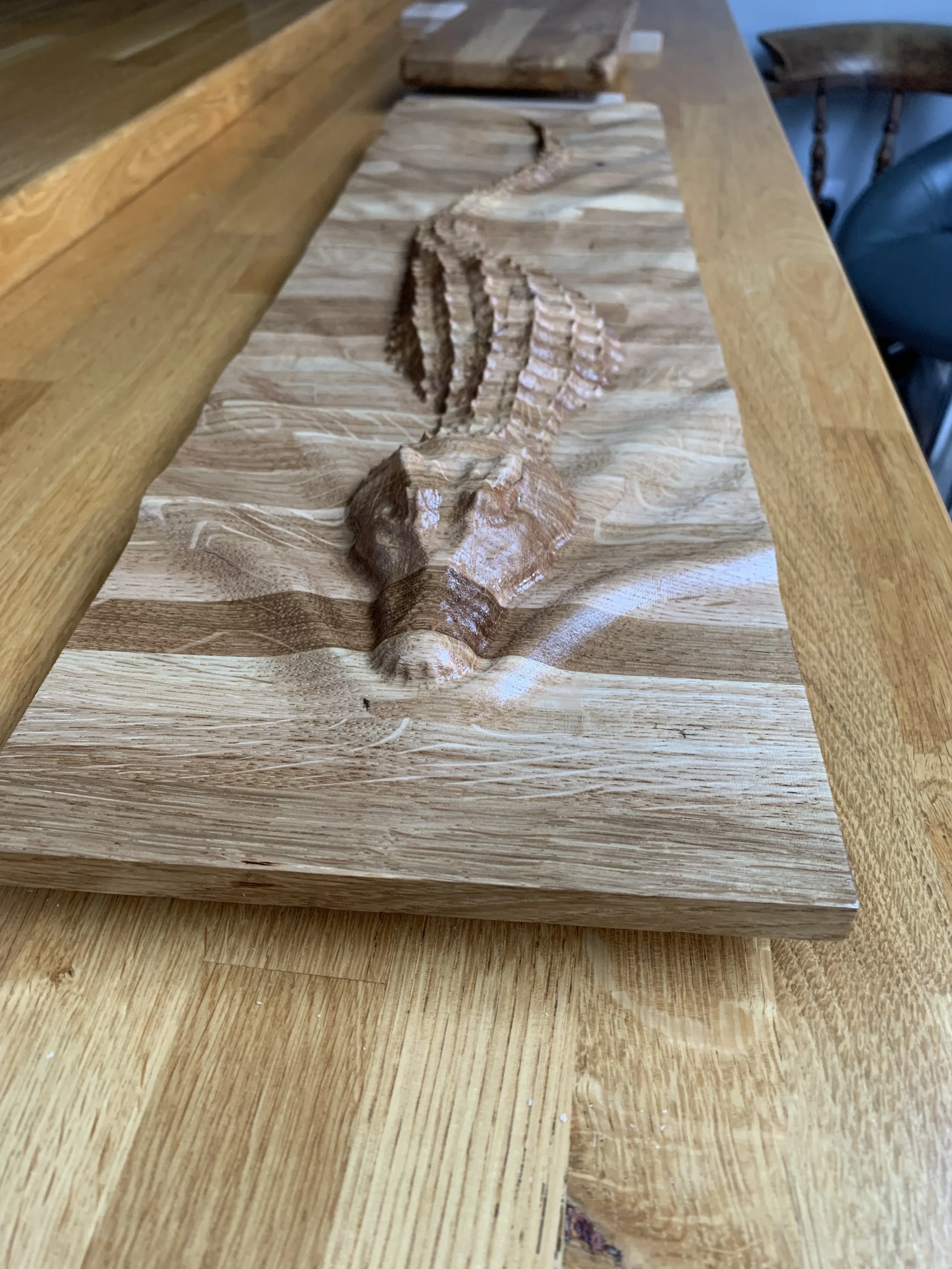 A wooden carving of a crocodile