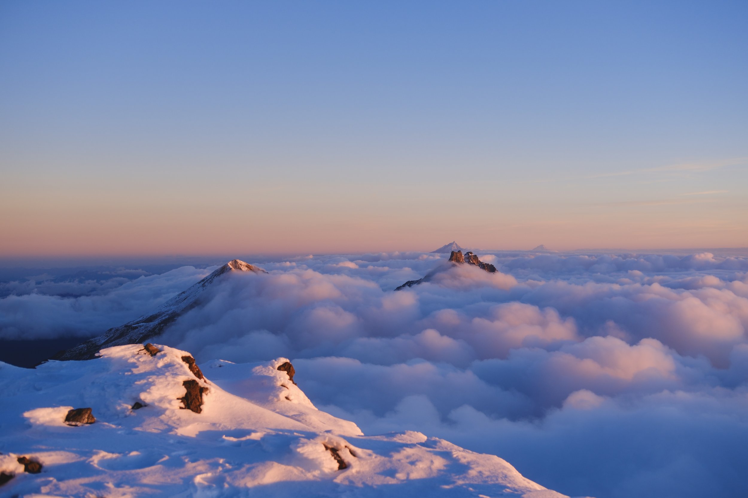 Looking at Middle and North Sister from the top of South Sister at 7:12am. Bend, Oregon