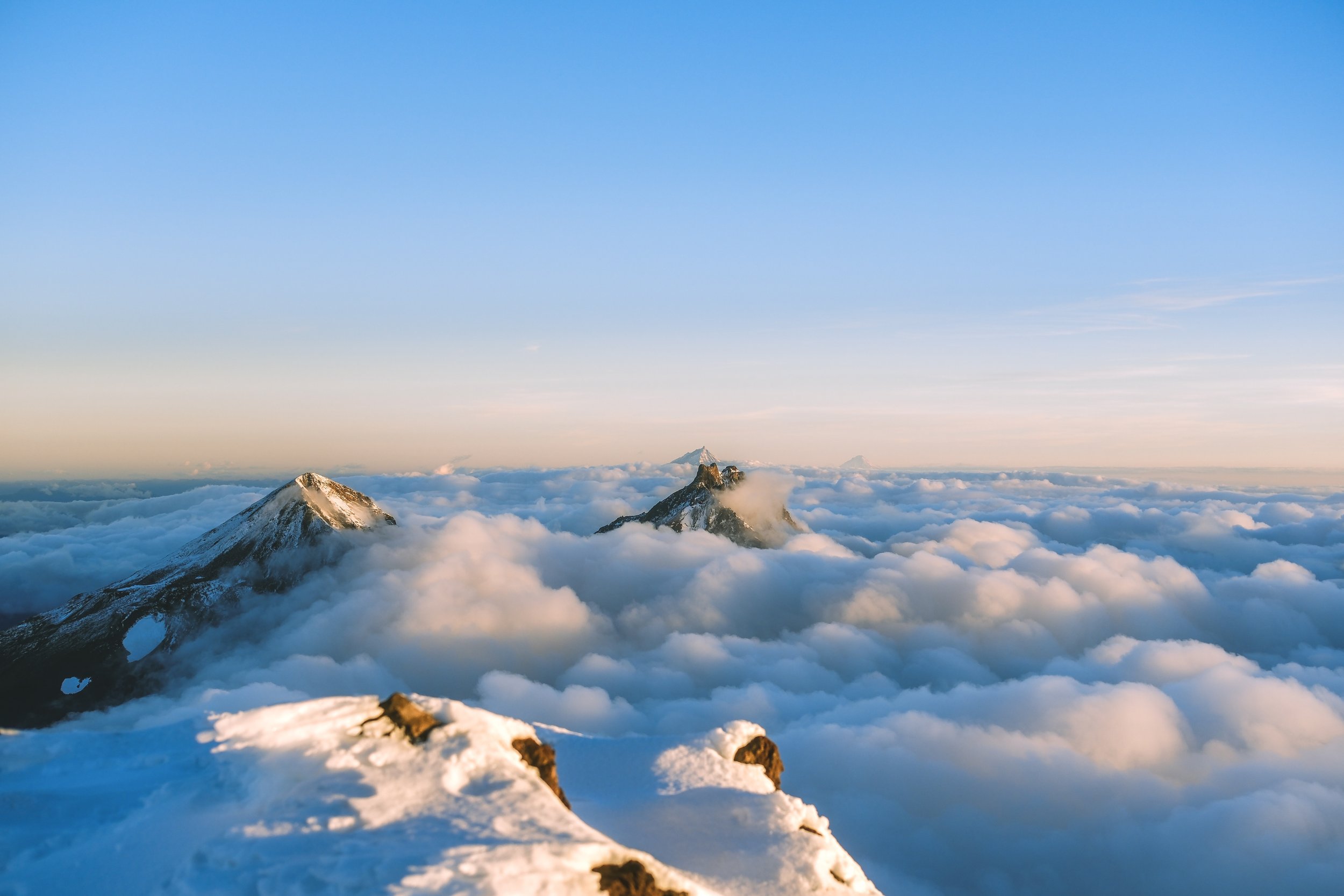Looking at Middle and North Sister from the top of South Sister at 7:23am. Bend, Oregon 