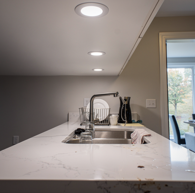recessed ceiling lights spaced across a living room ceiling
