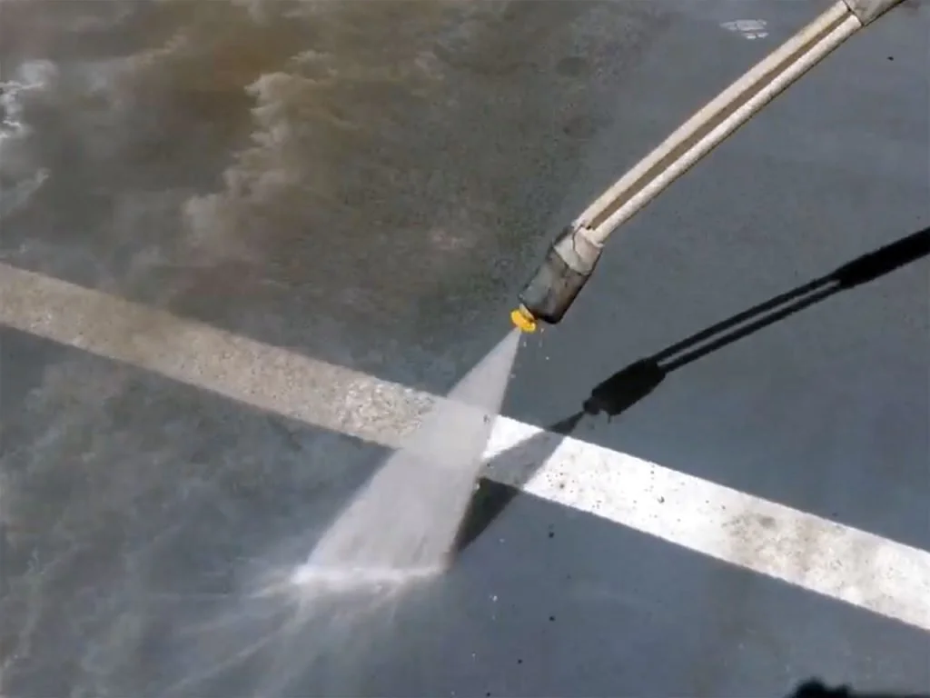 Pressure washing parking lot