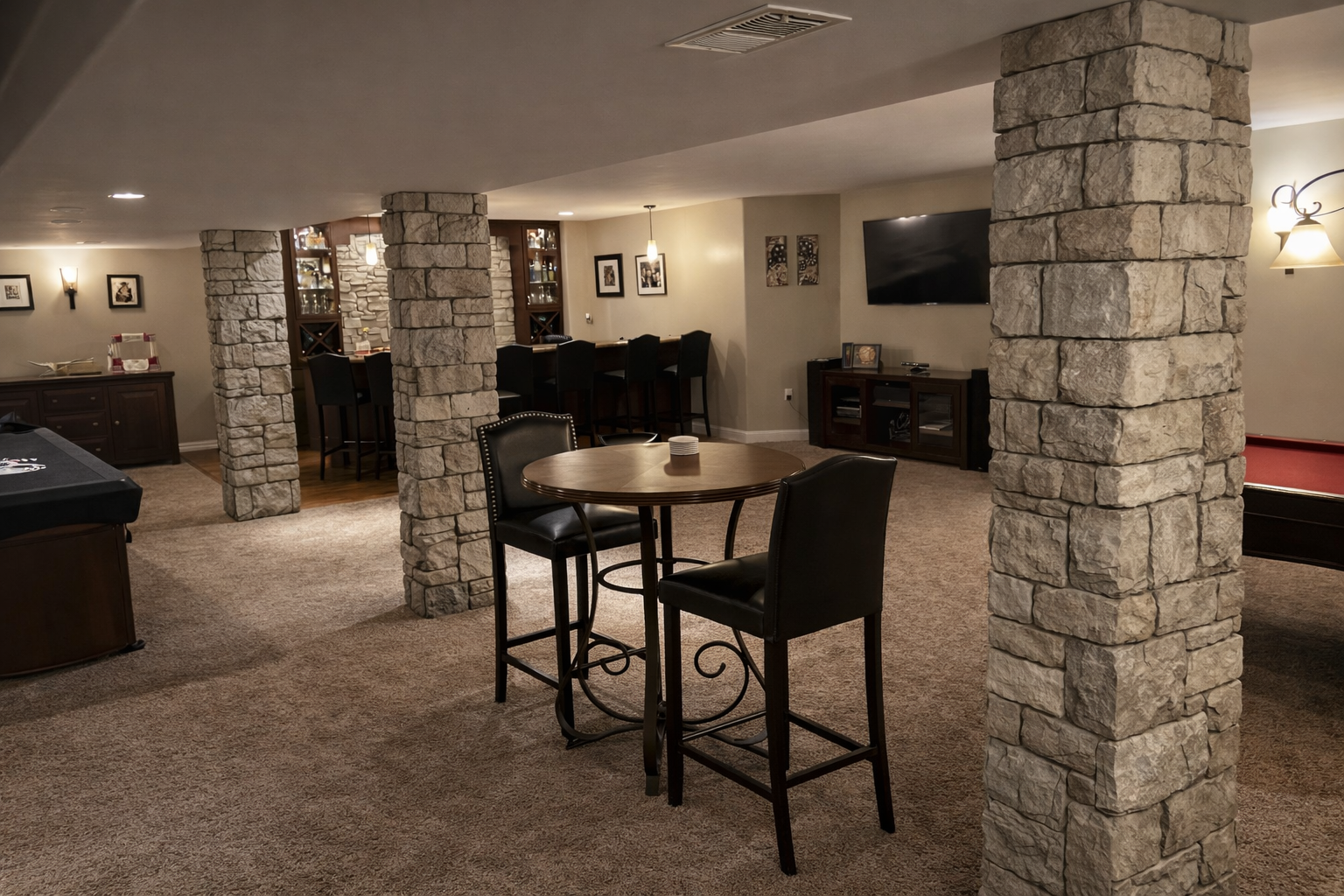 Cozy basement entertainment space with bar.png