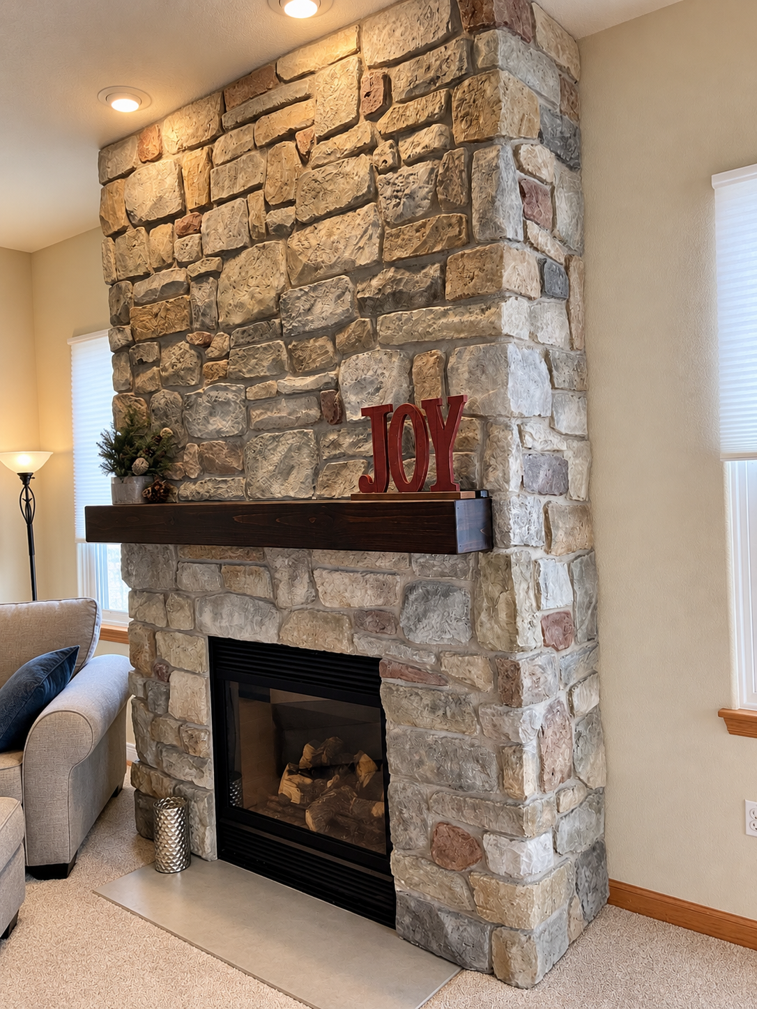Cozy Stone Fireplace with Joy Decor (1).png