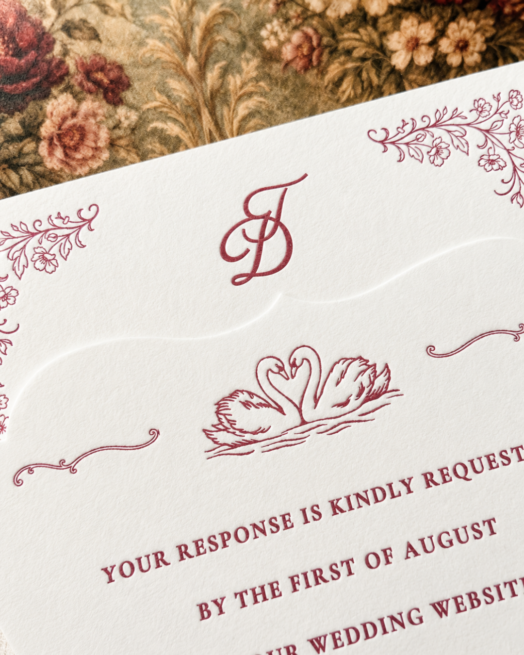 Paige & Press Custom Experience close-up of the luxury letterpress RSVP card featuring hand-illustrated swans, floral details, and heirloom-inspired typography.