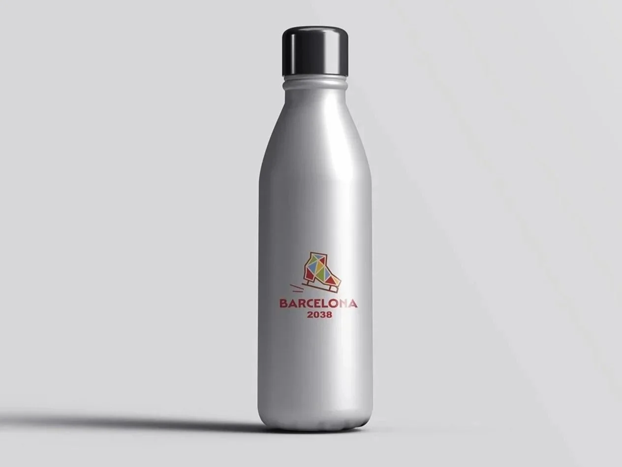 Silver insulated bottle with a black cap, featuring a colorful geometric logo of a skate and the text 'Barcelona 2038' on a plain background.
