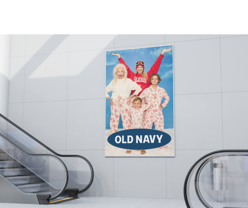 Advertisement banner at an airport showing a family in winter clothes and Old Navy branding.