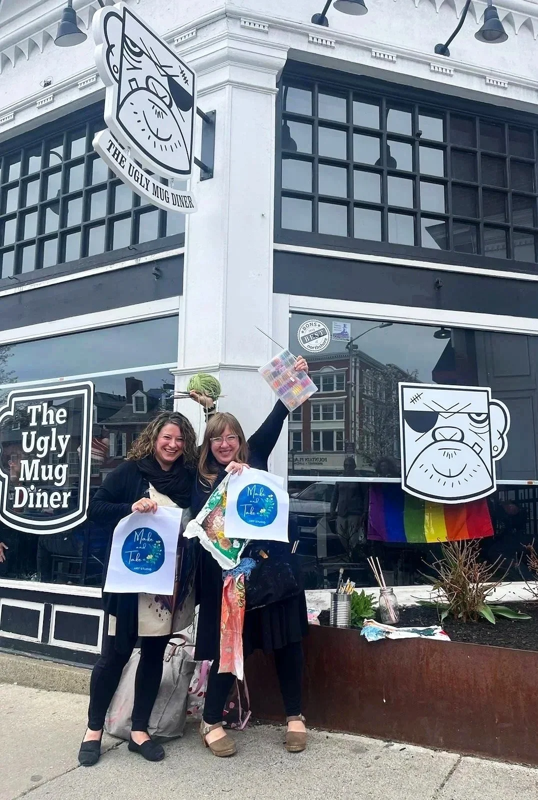 Jen and Sarah standing outside The Ugly Mug Diner, in Salem, MA where Make and Take Art Studio Classes and Workshops are currently offered.