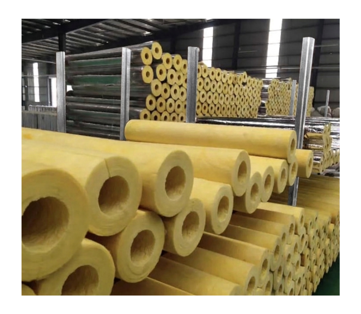 Fiberglass pipe insulation stacked at Westcan Thermal Inc. warehouse.