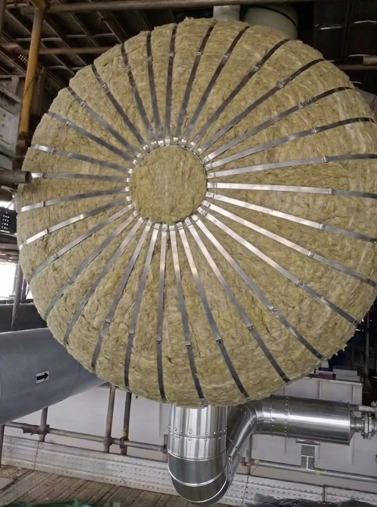 Mineral wool (rockwool) insulation wrapped around a pressure vessel or heat exchanger.