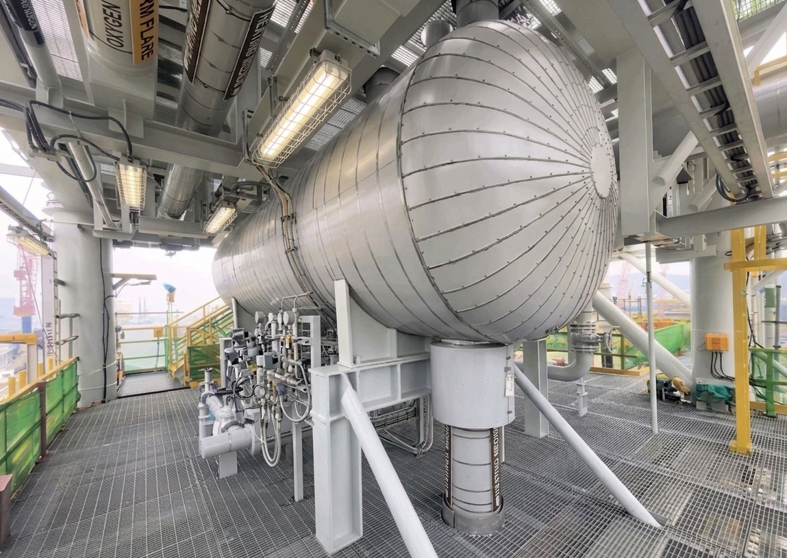Pressure vessel and heat exchanger insulation with mineral wool (rockwool) and metal cladding.