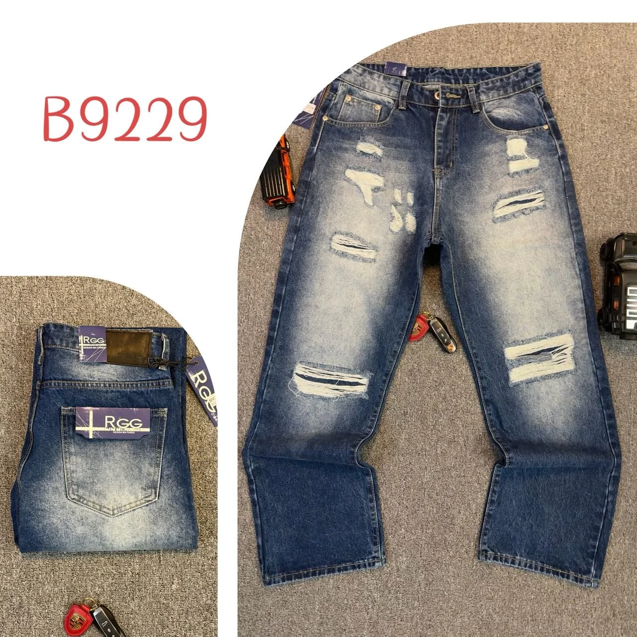 Pair of distressed blue jeans with multiple rips and tears laid flat on grey carpet, surrounded by tools and devices, with a pocket showing a price tag and the code B9229.