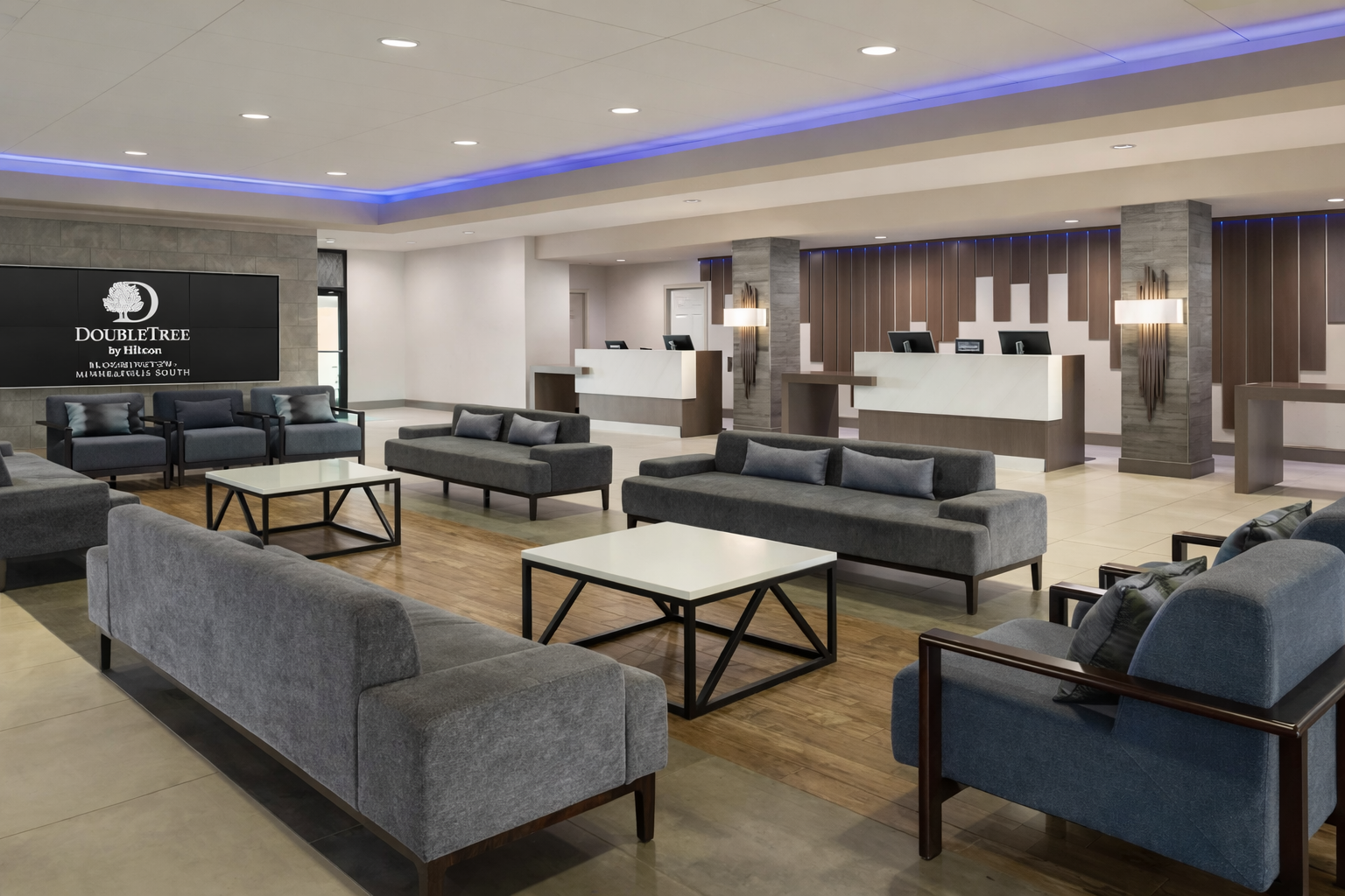 Modern hotel lobby with blue accents.png