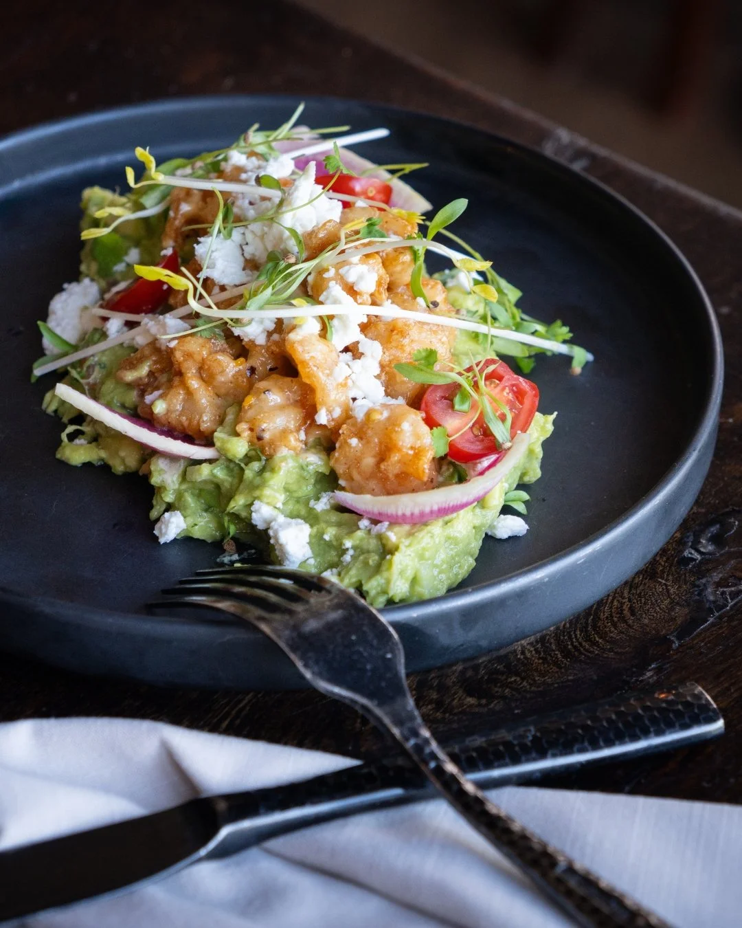 Sweet, spicy, crispy, creamy. Our Crispy Shrimp Chicharr&oacute;n layers golden fried shrimp, fresh mango pico de gallo, citrus chipotle honey, and house-made guacamole for a bite that's impossible to forget.