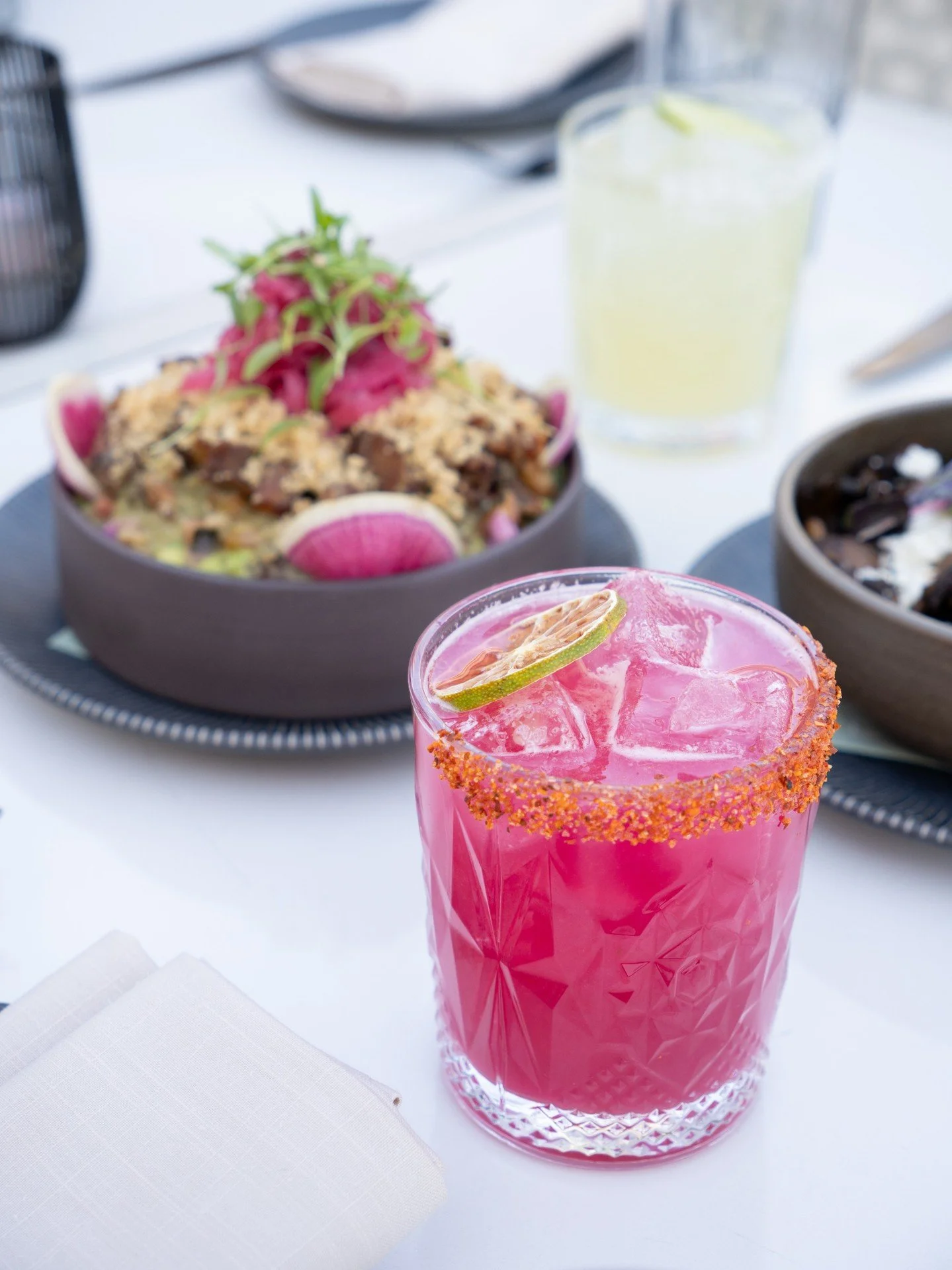 A true taste of the southwest, the Barbary Fig Margarita blends tart lime with sweet prickly pear and bold tequila for a drink the complements any dish.