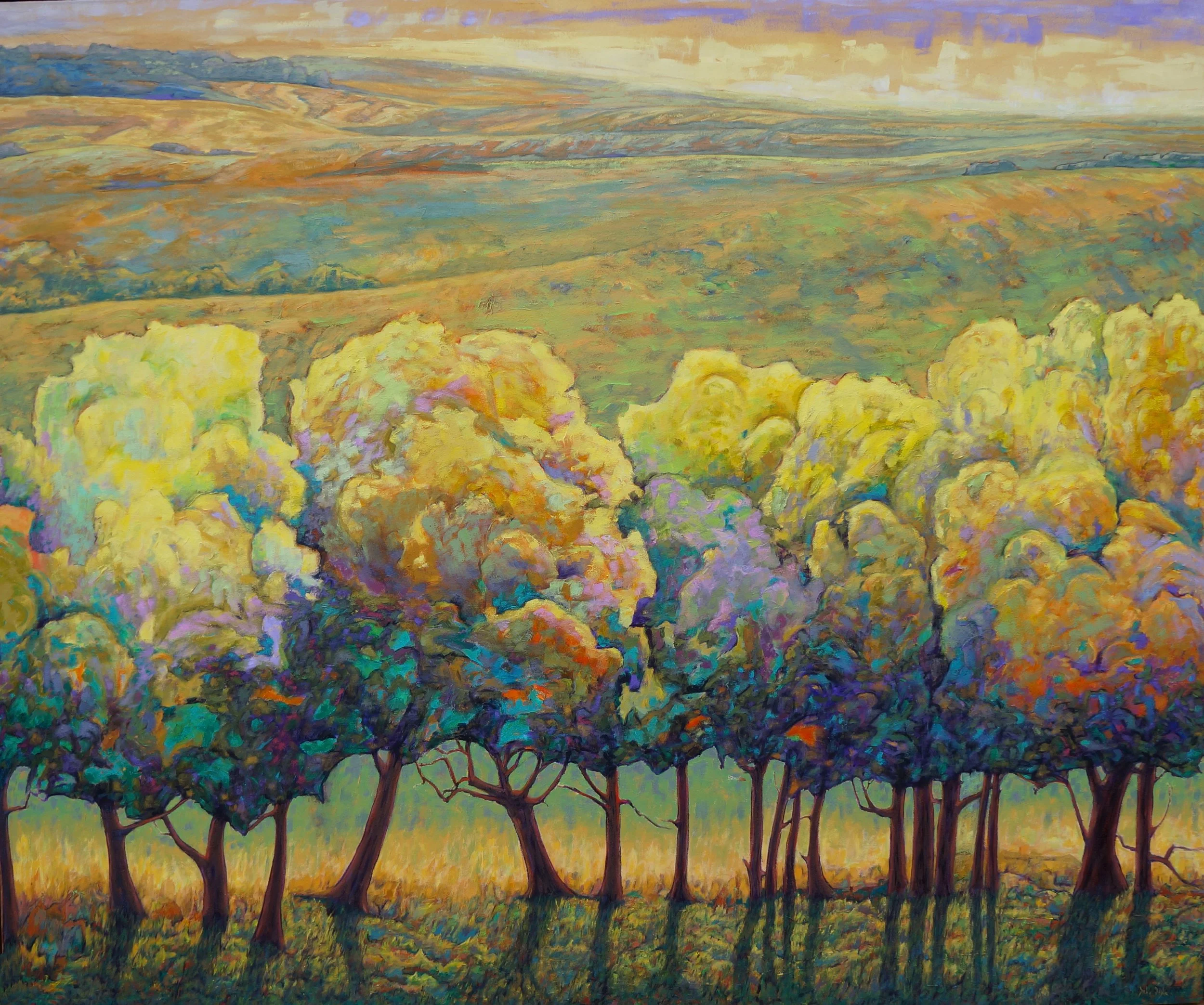 A colorful landscape painting of a row of trees with vibrant, multicolored foliage in front of rolling hills and expansive sky.