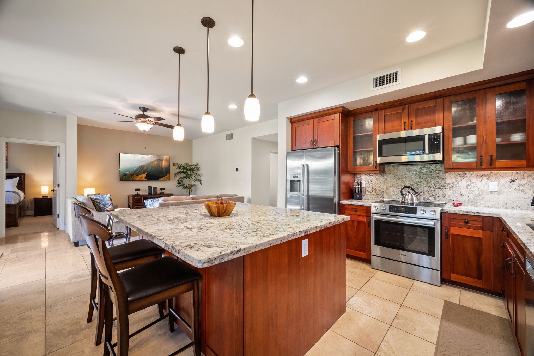 Open floor plan connecting the living room and fully equipped kitchen
