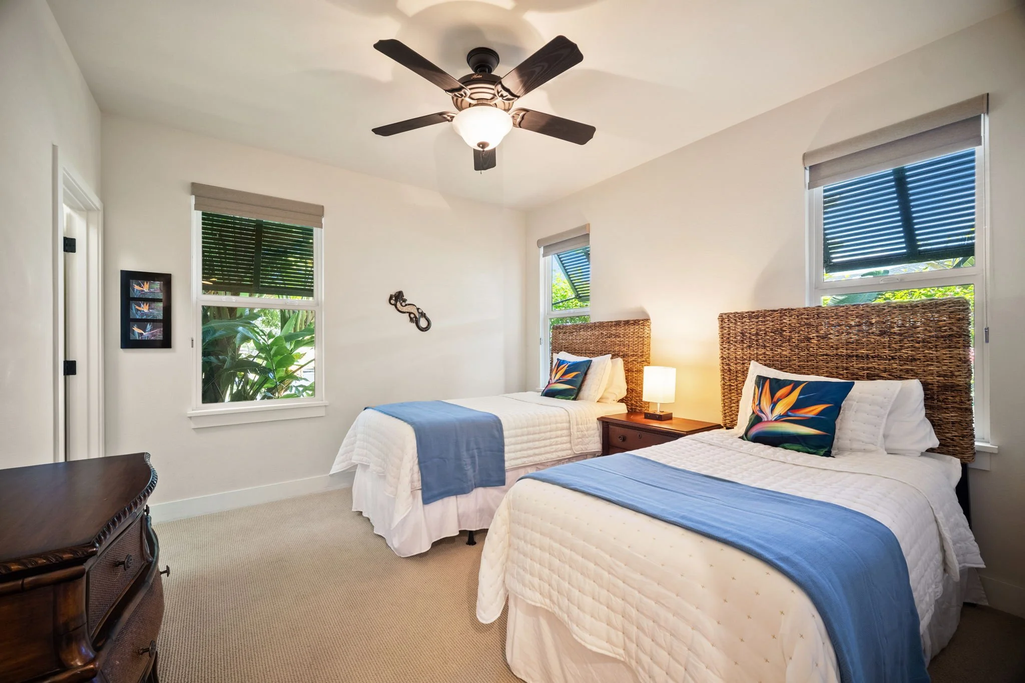 Second bedroom with two twin beds and ceiling fan