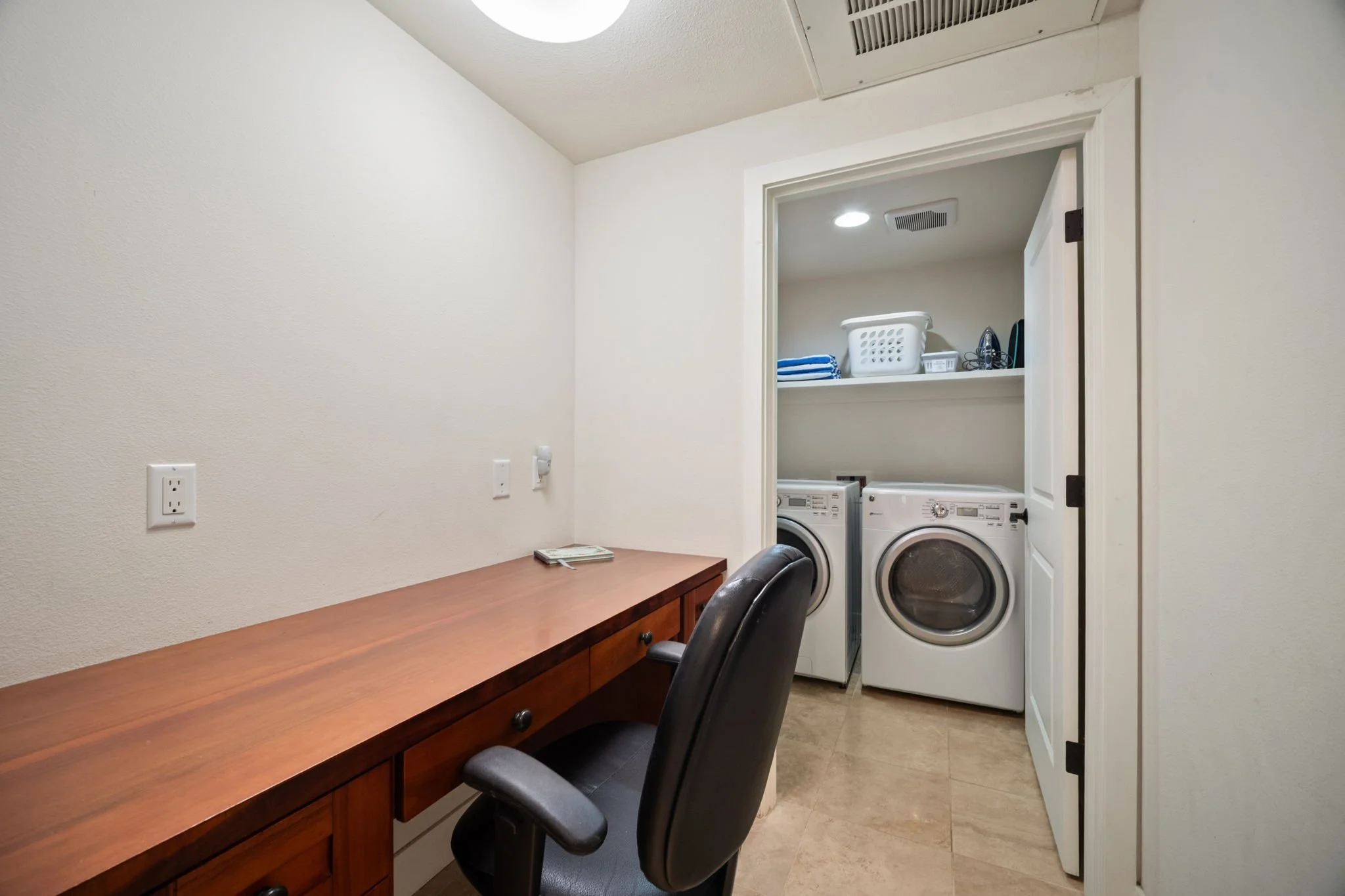 Executive desk area with in-unit washer and dryer