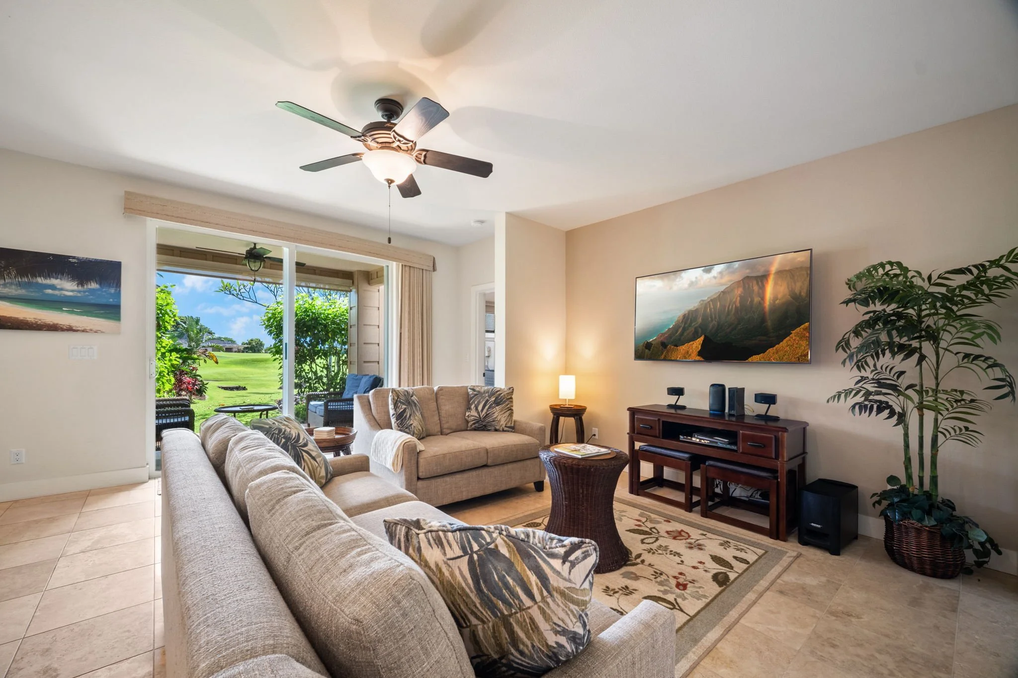 Living room with golf course views through the lanai doors