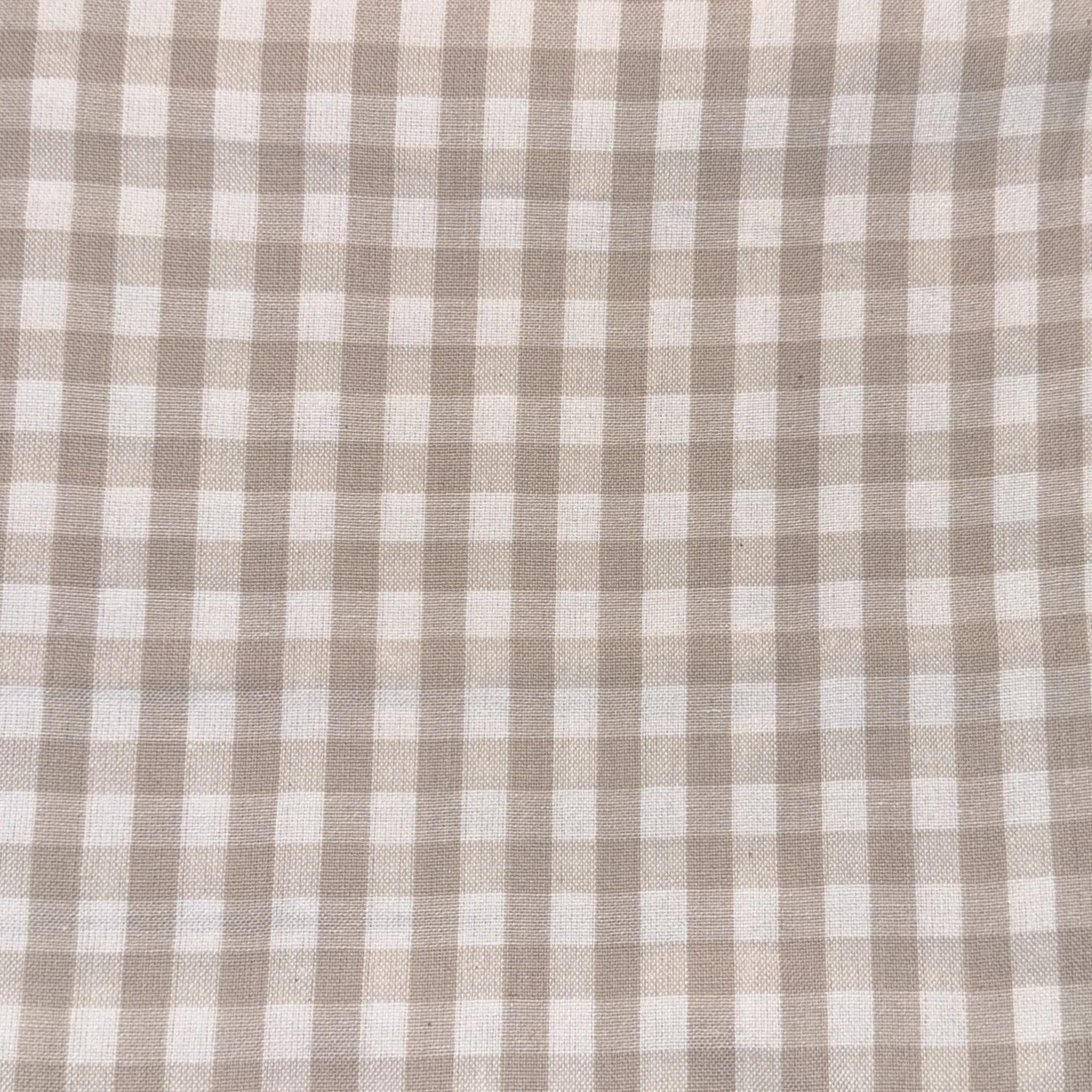 Beige and white checkered fabric pattern.
