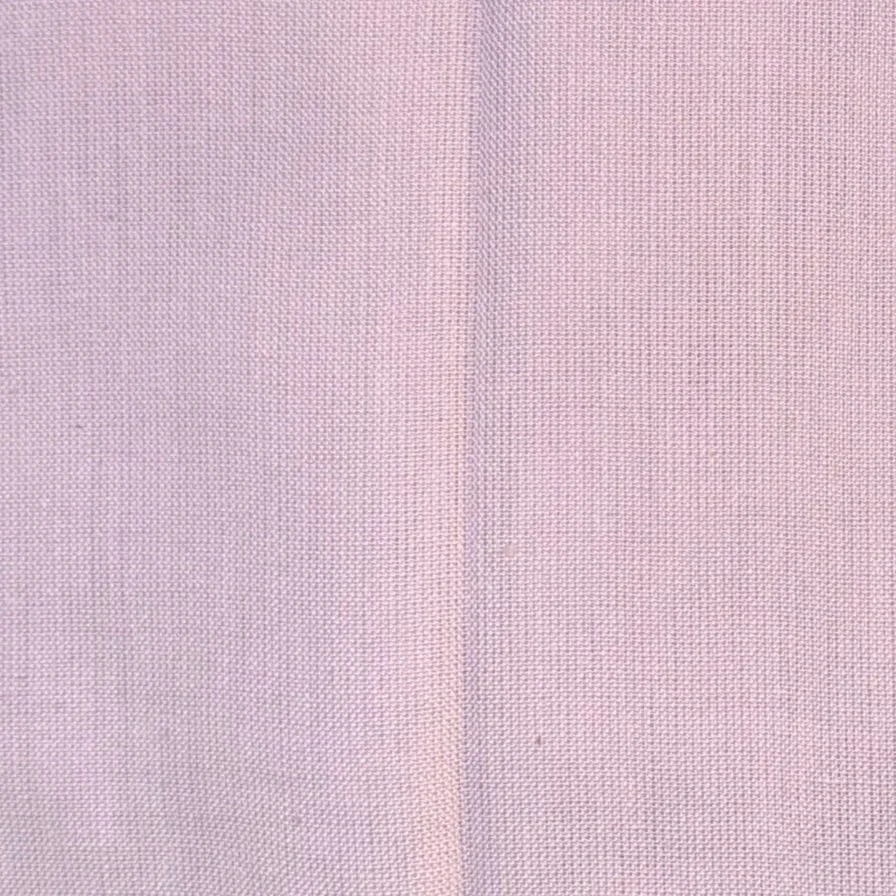 Close-up of light pink fabric with fine woven texture.