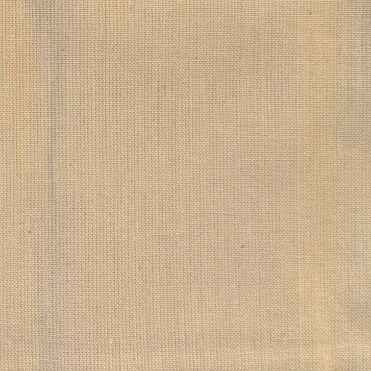 A close-up of beige fabric with visible woven texture.
